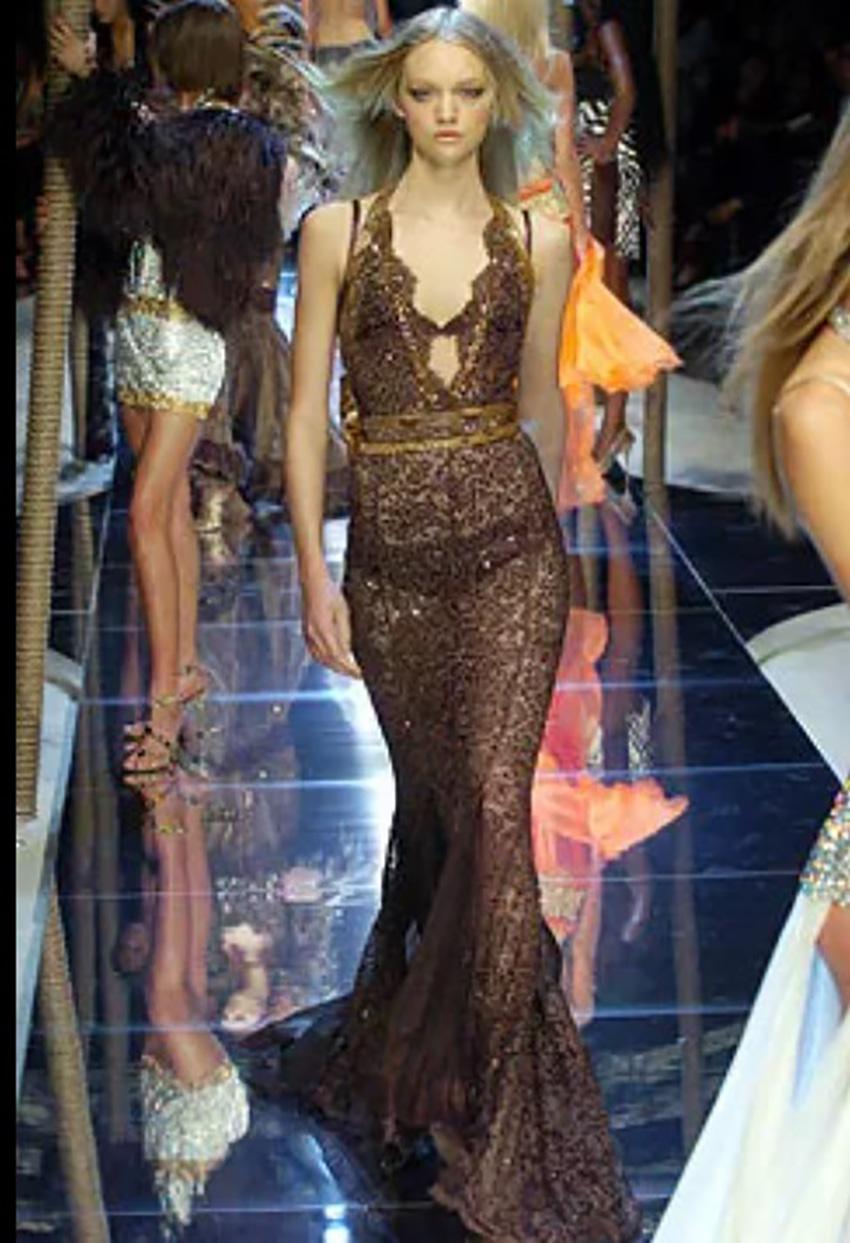 DOLCE&GABBANA

HOT!!!
Collection Spring/Summer 2005 Look #84 
Beaded and Decorated with Snakeskin
Bow at the back
Brown lace
Back zipper

Content: 100% silk

Pre-owned. Very good vintage condition. 
PLEASE VISIT OUR STORE FOR MORE GREAT ITEMS


os