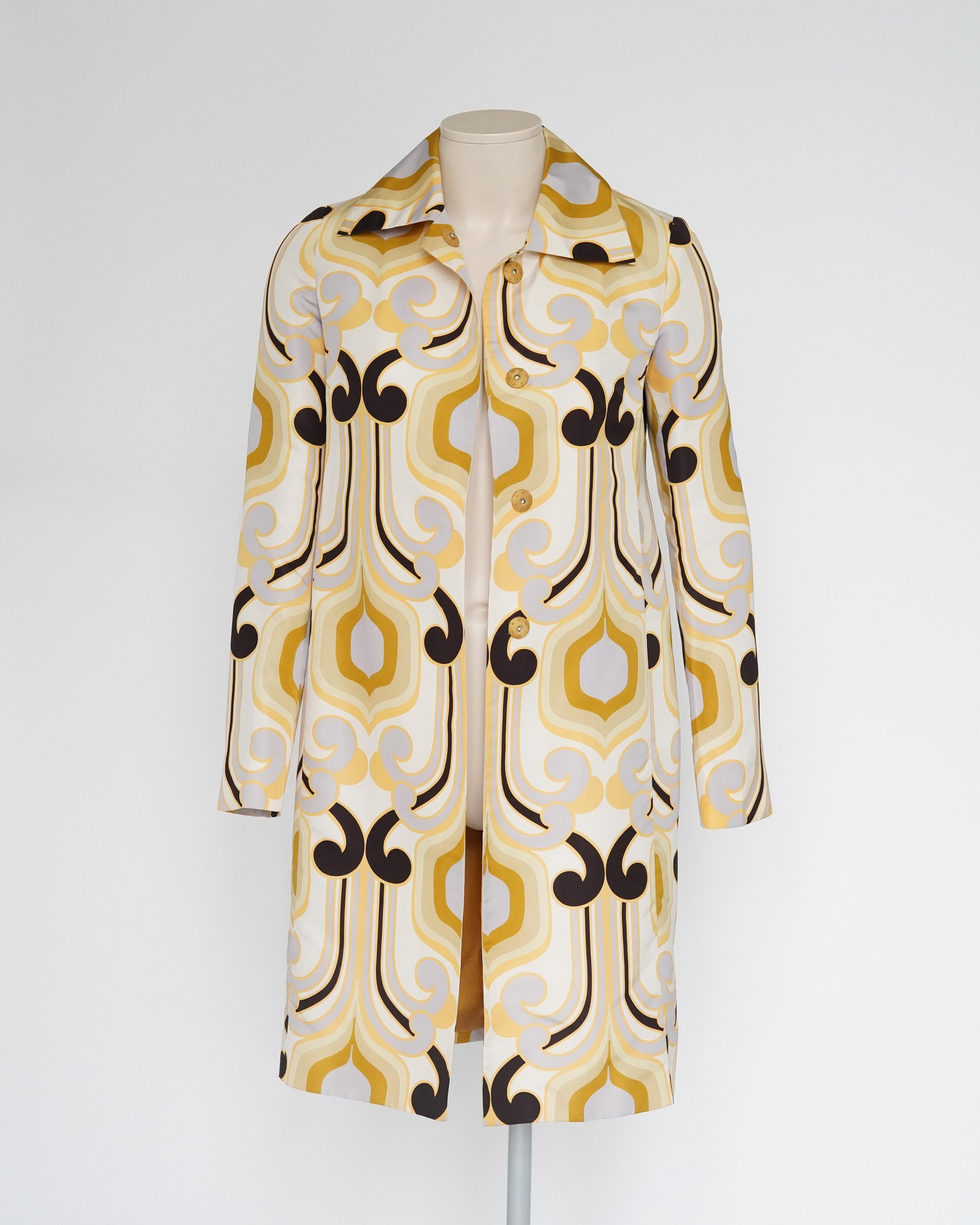 Introducing the Spring/Summer 2005 Miu Miu runway coat, featuring a 70s-inspired geometric print. The Spring 2005 Miu Miu collection garnered praise from the fashion elite and quickly became a retail favorite. Styledotcom described the show as
