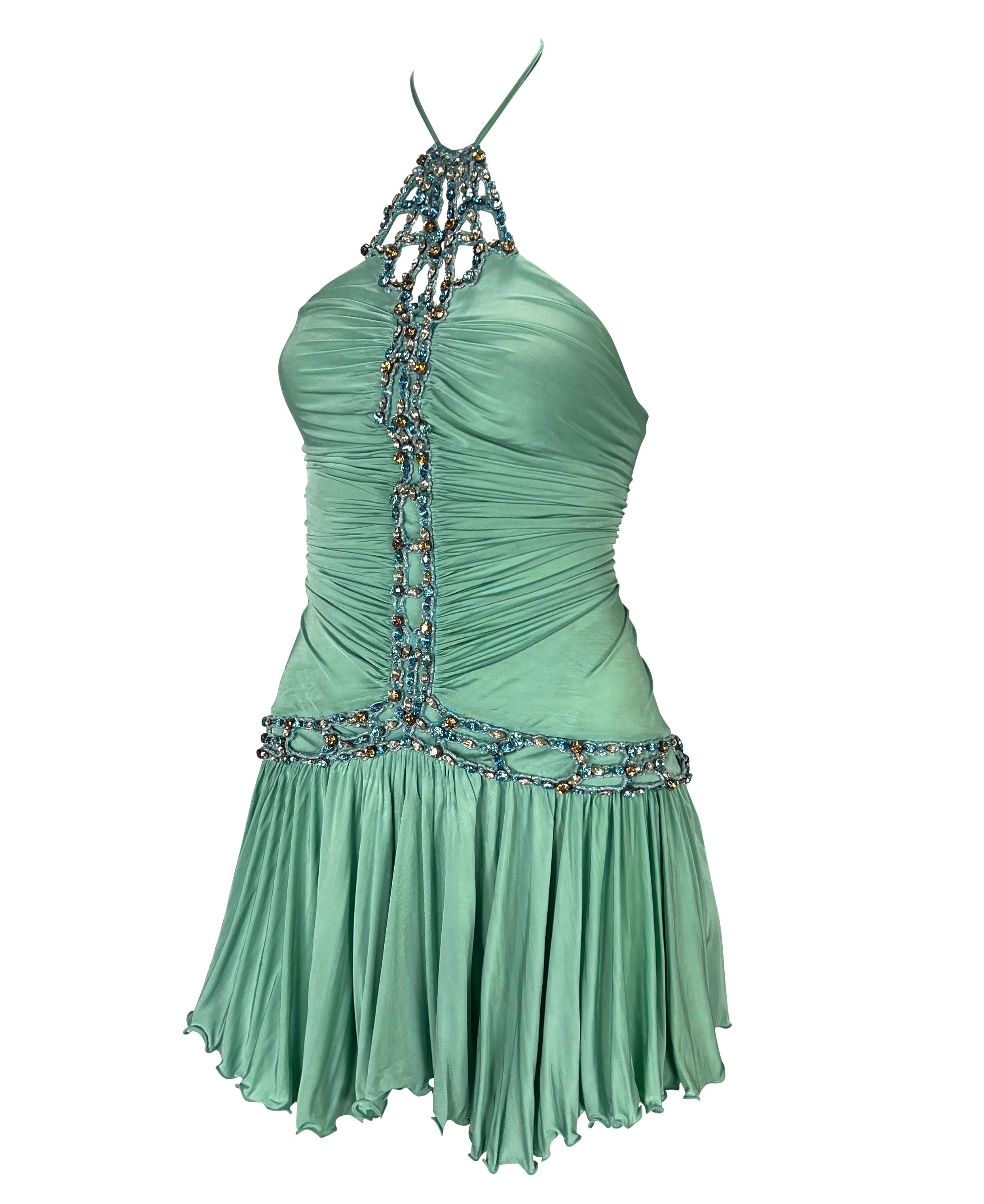 TheRealList presents: a gorgeous light blue Roberto Cavalli mini dress. From the Spring/Summer 2005 collection, this absolutely fabulous halter neck dress features stretch ruching at the body and a pleated flare skirt. This rare find is elevated