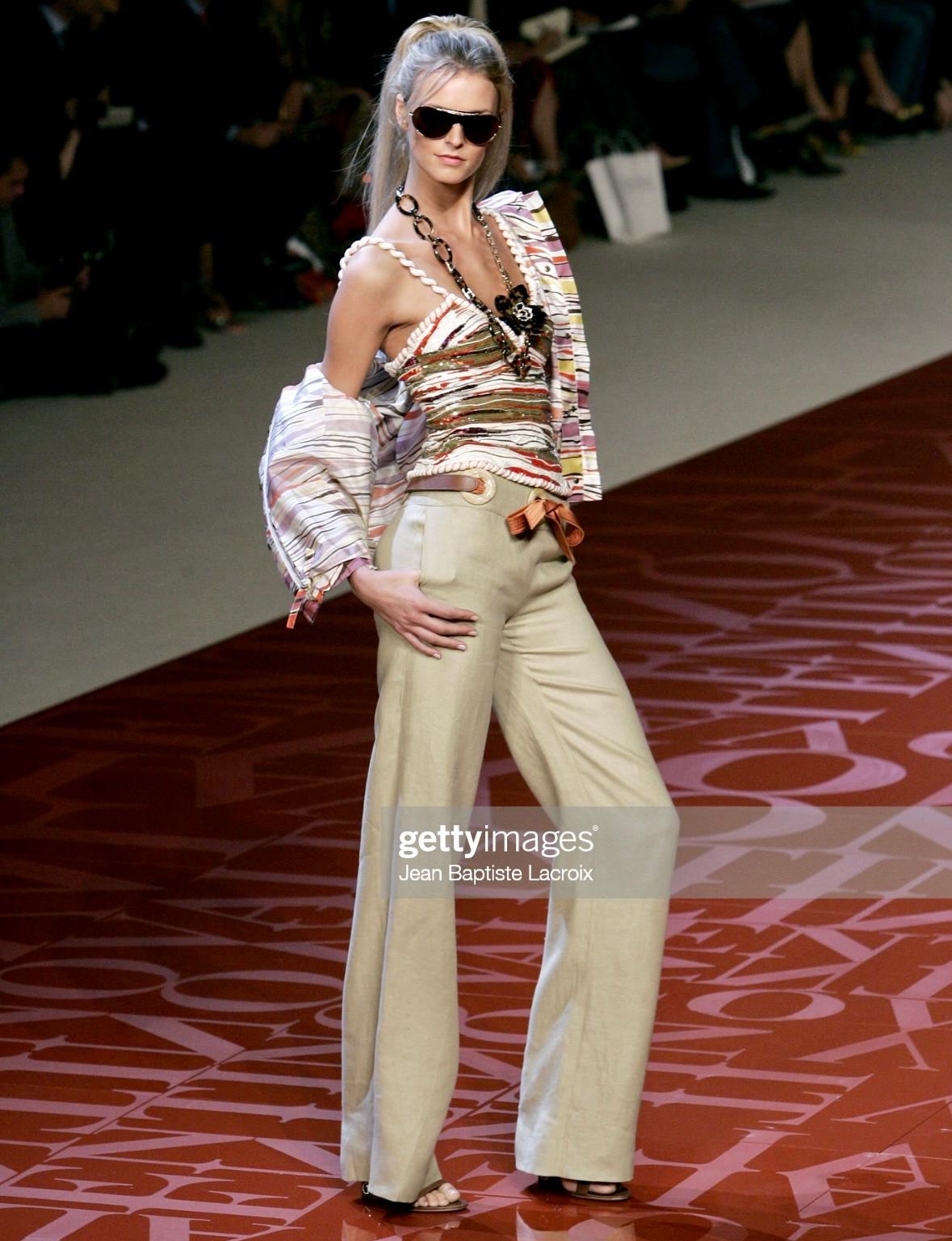 Presenting an incredible multicolor Valentino beaded tank top. From the Spring/Summer 2005 collection, this top debuted on the season's runway as part of look 6, modeled by Jacquetta Wheeler. The top features thin shoulder straps and a v-neckline.