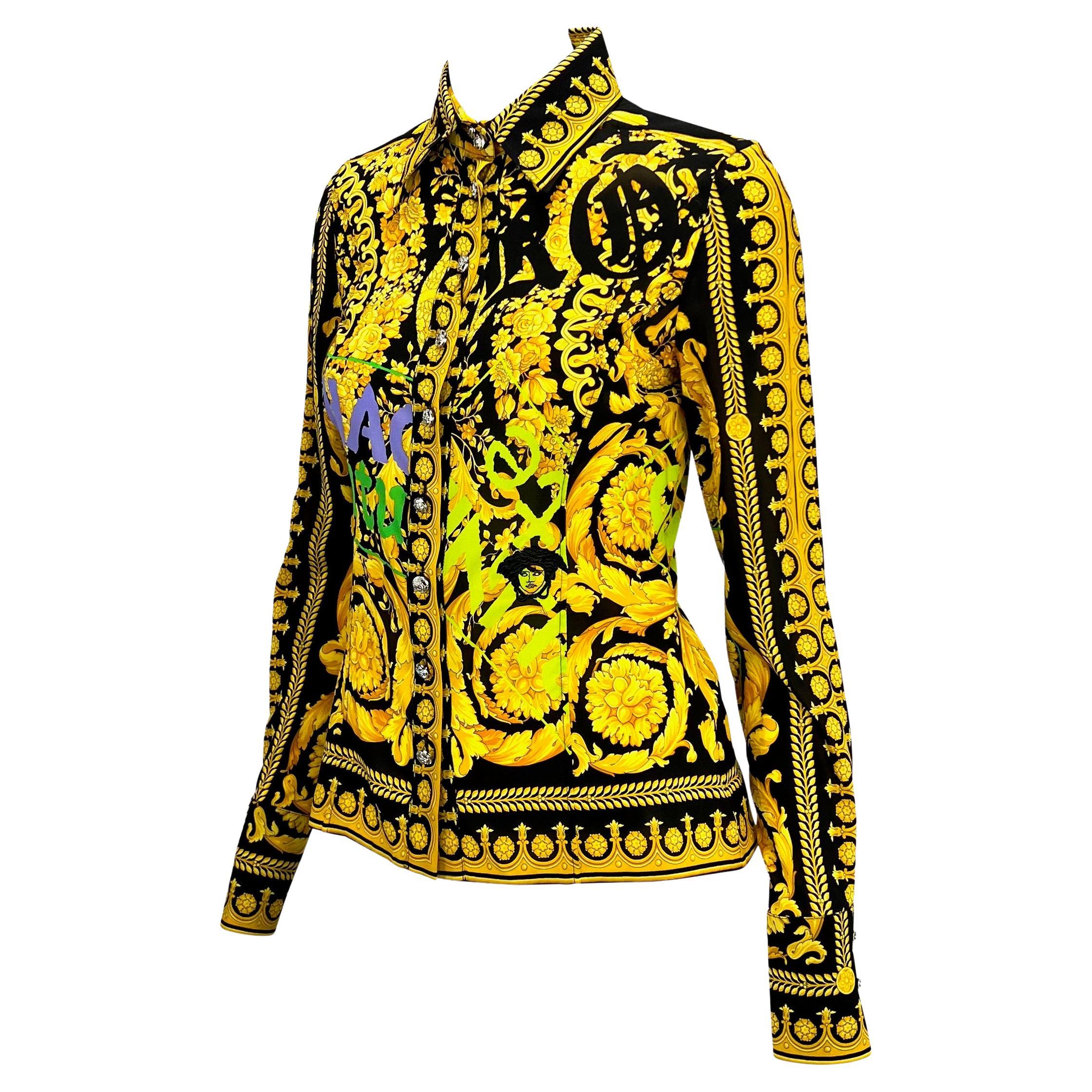 Presenting a Versace Chaos Couture collection shirt, designed by Donatella Versace. This collared shirt features neon 'Chaos Couture' stamps atop the classic gold and black Versace baroque pattern and an embroidered Medusa. Made complete with silver
