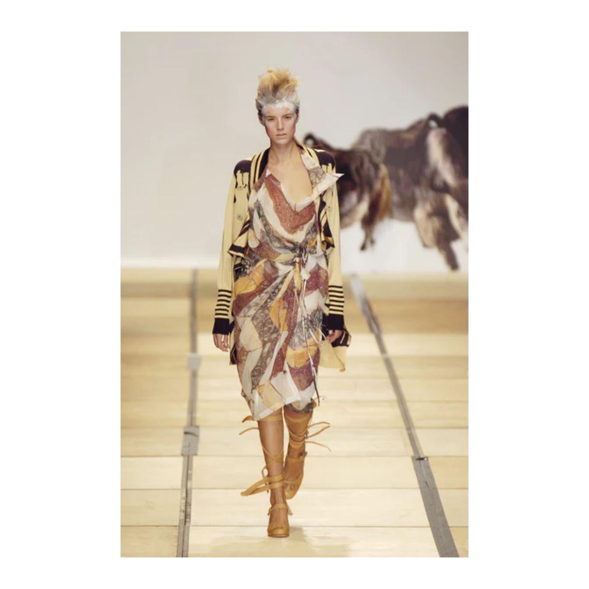 S/S 2005 Vivienne Westwood marble stripe print dress. Sculptural deconstructed semi-sheer silk dress with wrap tie at waist. High-low design with long point at back. Wrap tie can be styled in a variety of ways depending on desired effect and