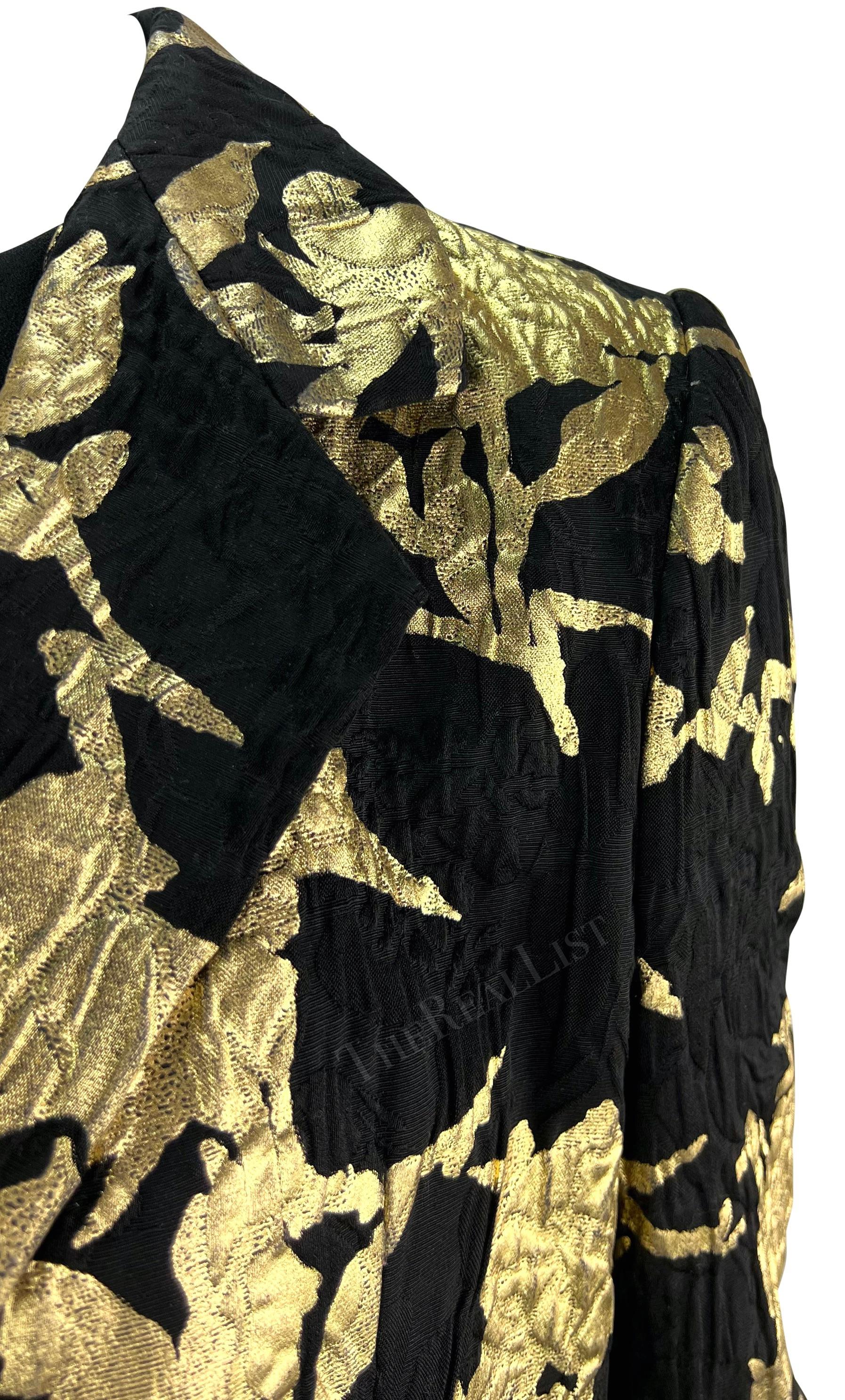 Presenting a fabulous black and gold Christian Dior haute couture dress set, designed by John Galliano. From the Spring/Summer 2006 collection, this set is comprised of a black long-sleeve gown and matching black and gold jacket. The dress features