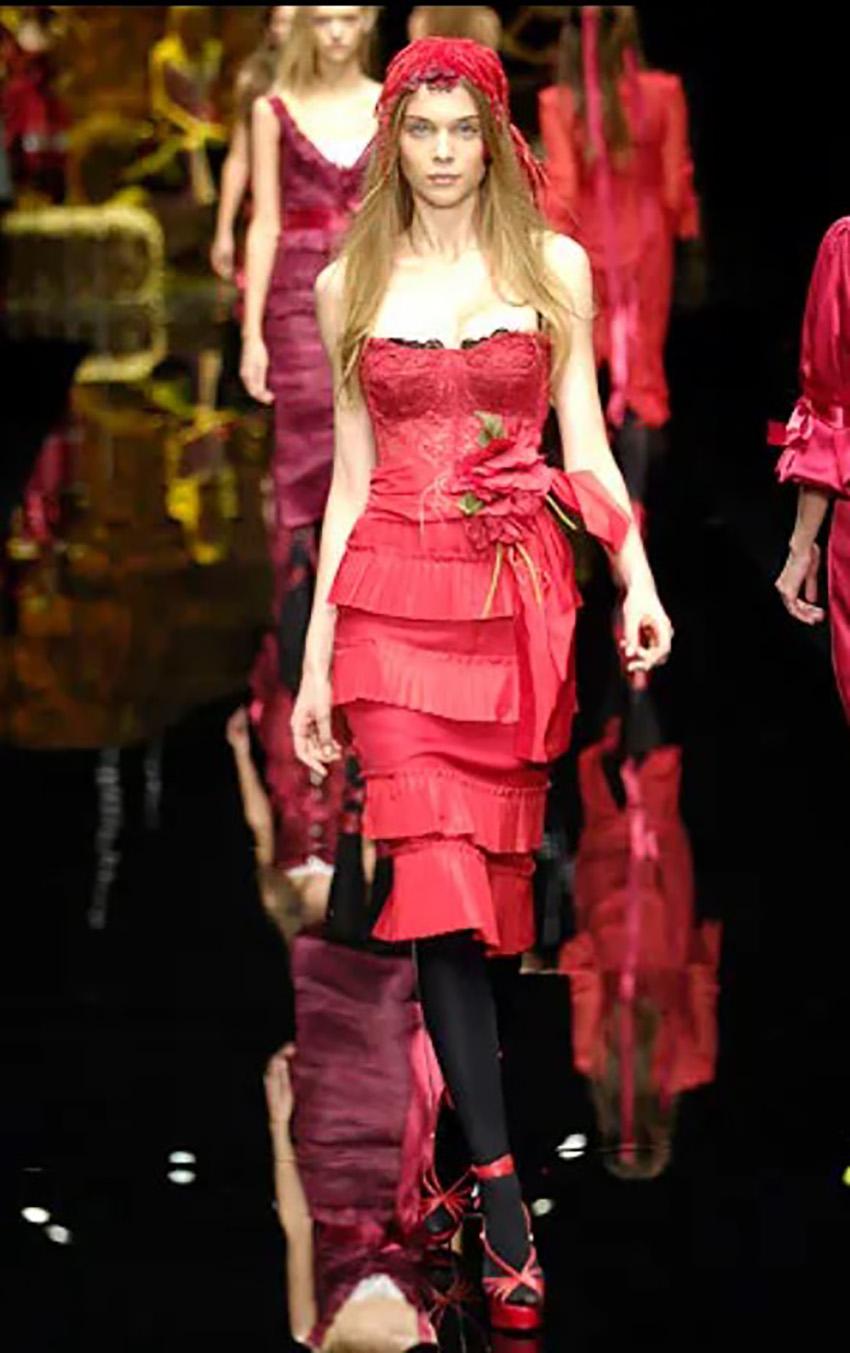 DOLCE & GABBANA
Spring / Summer 2006 Look # 4 
Red Poppy Corset Dress by Dolce & Gabbana 
Lace corset top
Pleated detail around dress skirt
Black built in lace bra
Backless
Sleeveless
Spaghetti straps are adjustable 
Back zipper closure 


Back of