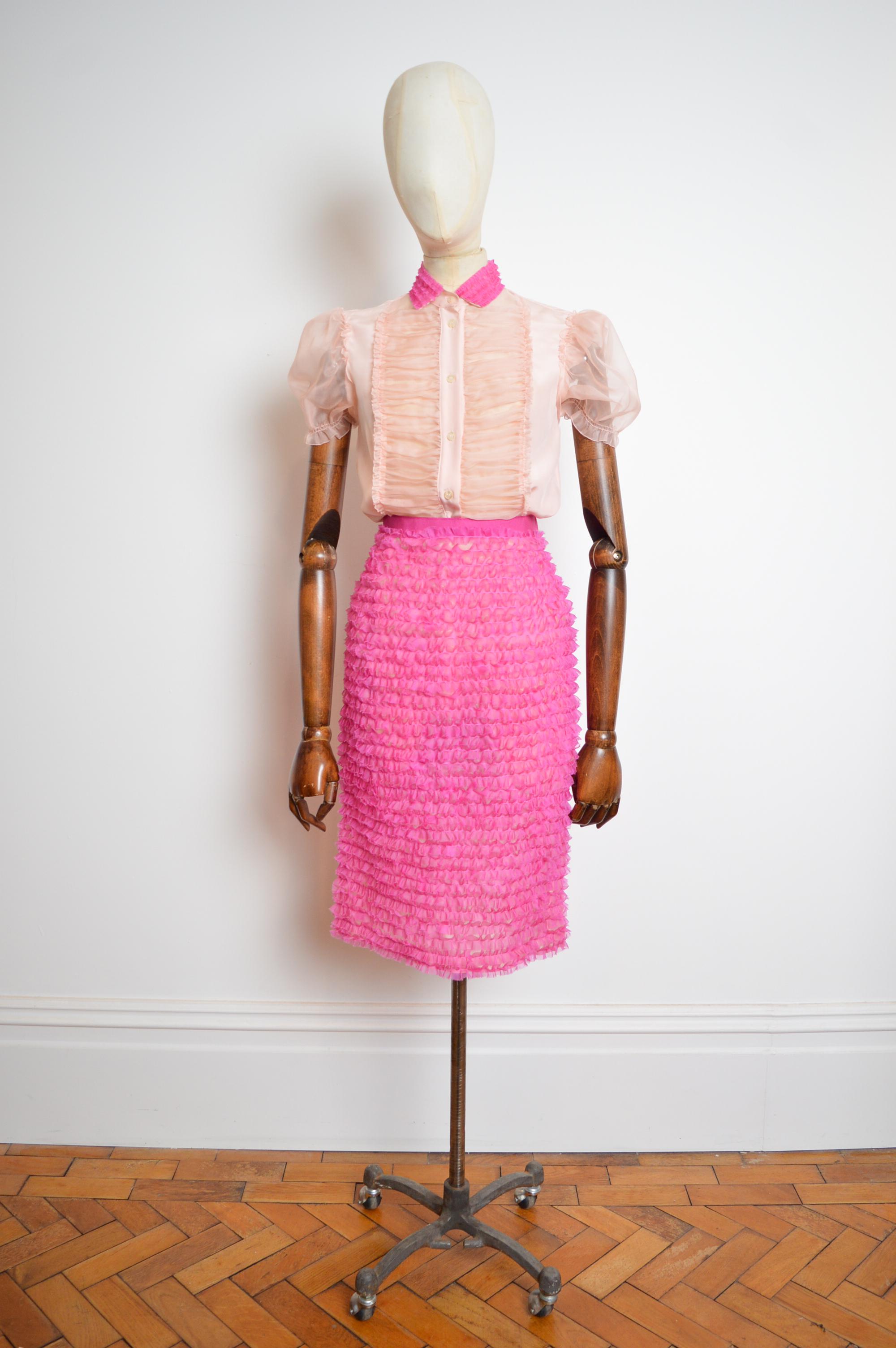 Short sleeved Ballet pink & Blushing hot pink silk tulle ruffled blouse with buttons down the front and matching high waisted pencil skirt from the 2006 Spring / Summer Collection by DOLCE & GABBANA. 
Blouse Pit to Pit; 17.5”
Nape to Hem; 27”
Skirt