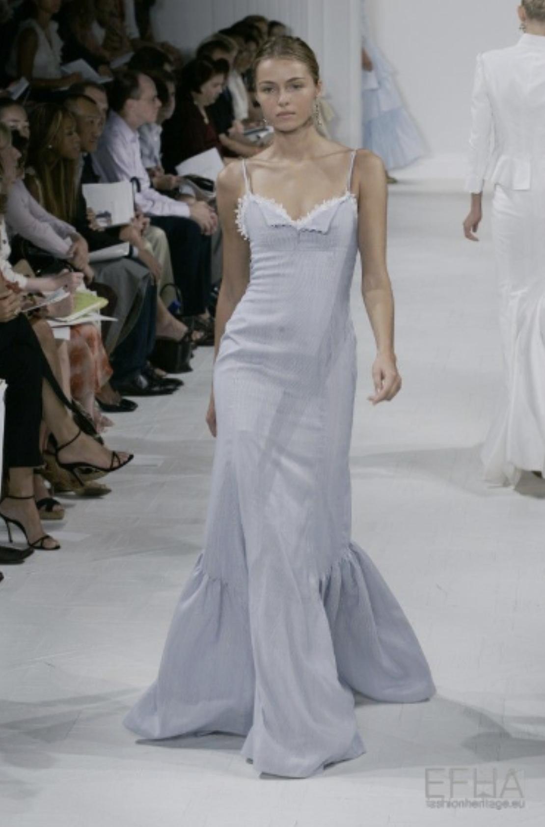S/S 2006 Ralph Lauren pinstriped blue and white lace trim gown. Sleeveless fitted mermaid style gown with blue and white pinstriped pattern throughout, and full skirt with gathering at mid-thigh. Lace trim with white broderie anglaise and cotton