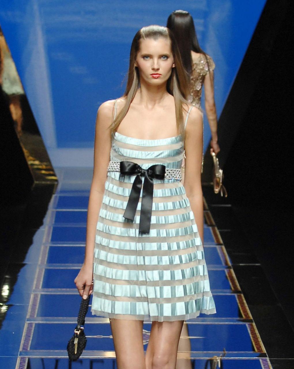 S/S 2007 Valentino sky blue pleated mini dress with black silk bow. Spaghetti strap sleeveless mini dress with crystal embellishments at waist and alternating pleating and mesh horizontal striped paneling. Concealed side zip closure, snap closures