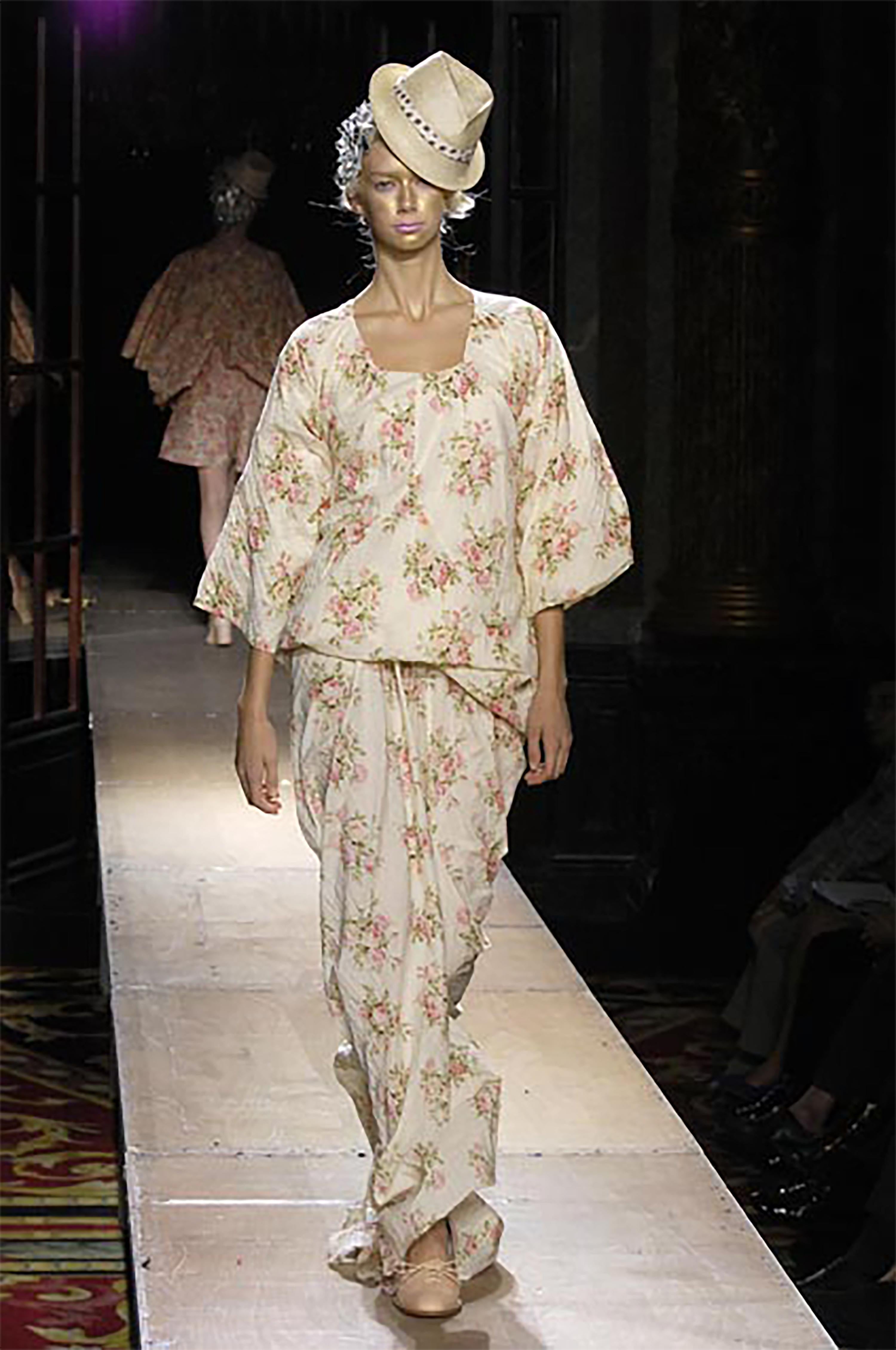 S/S 2008 Junya Watanabe ecru cotton dress with pink floral pattern. Three-quarter sleeve square neck gown with elasticized gathered waist. Features long, pointed train. Pull-over gown (elasticized waistband upper is built in). Fabric Contents: 100%