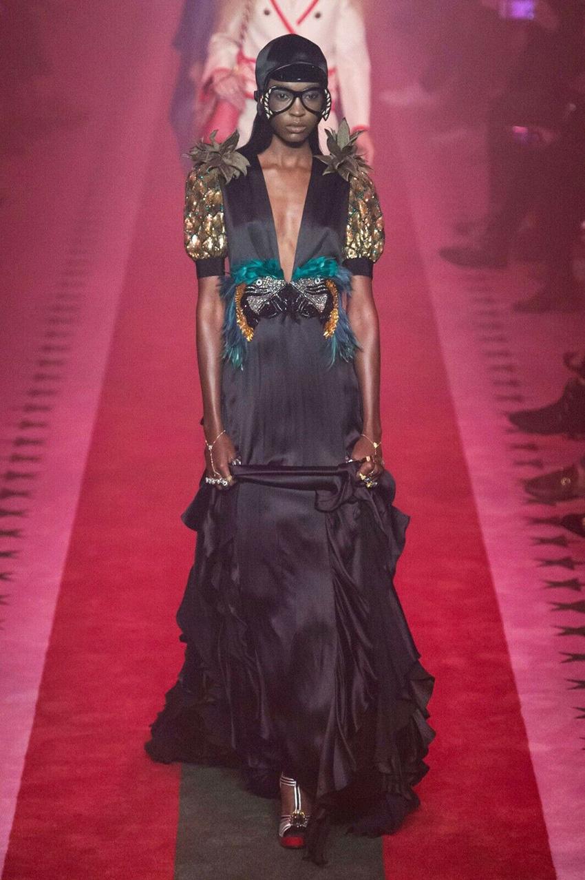 GUCCI 

S/S 2017 L# 54 
PARROT & PINEAPPLE SATIN GOWN

Athiya Shetty’s second outfit which was a beautiful parrot and pineapple satin viscose gown from Gucci was not completely copied but you can say was inspired by another Hollywood actress. Well,