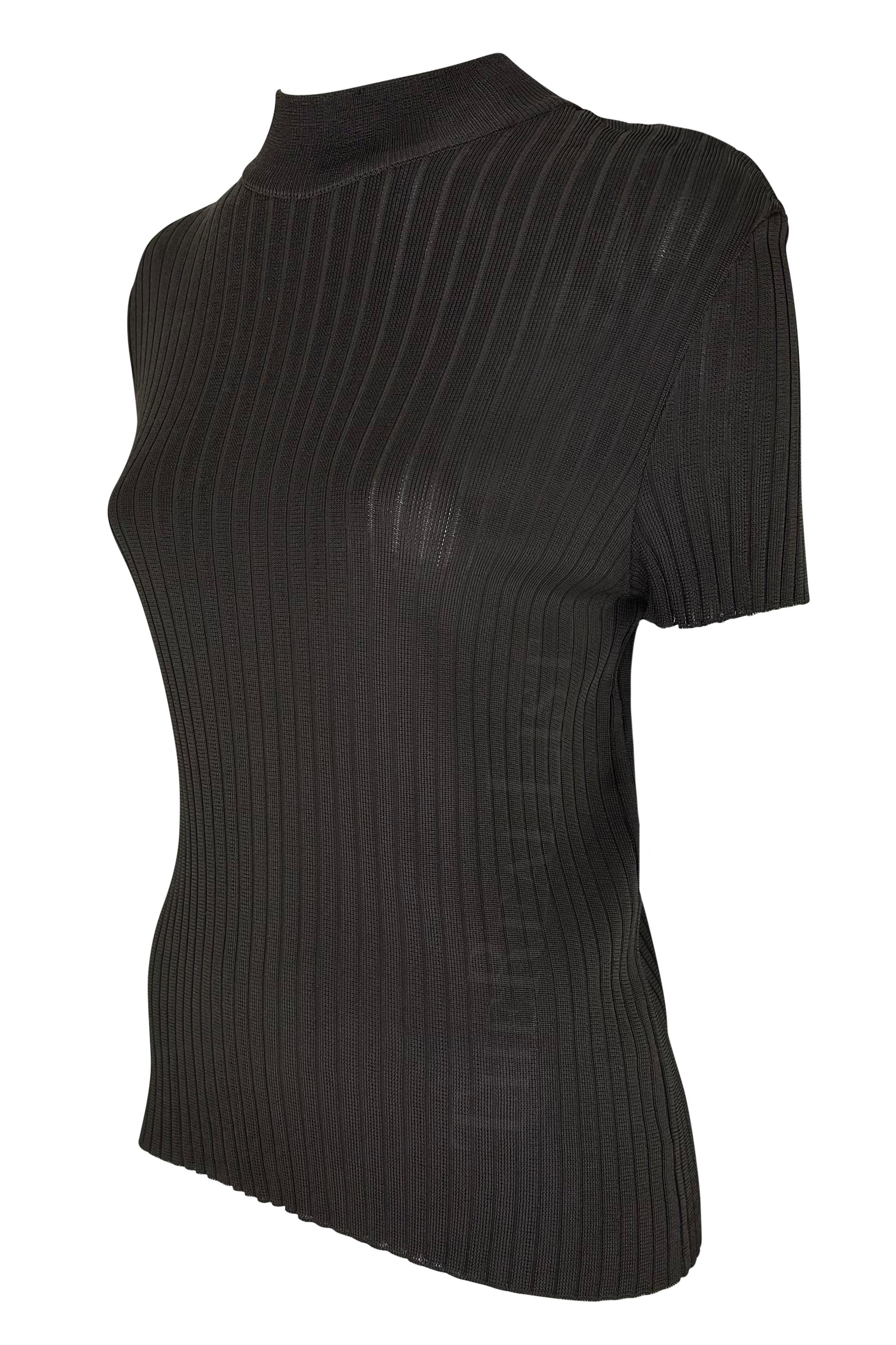 TheRealList presents: a fabulous brown knit Gucci top, designed by Tom Ford. From the Spring/Summer 1997 collection, this semi-sheer top features a vertical stripe pattern, mock neck, and short sleeves. The perfectly elevated closet staple, this