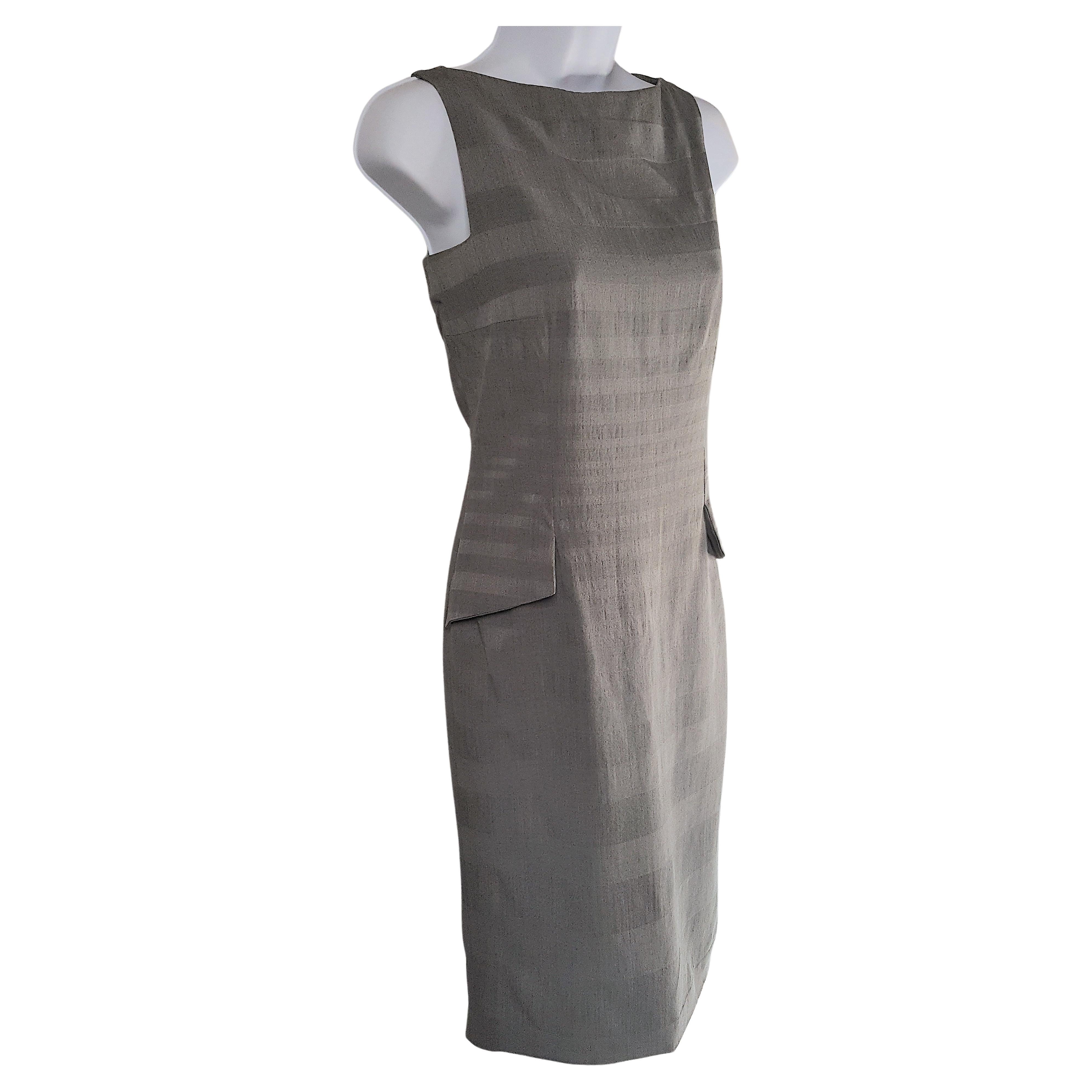 Acquired from the French flagship Christian Dior Boutique in Paris when John Galliano was its artistic director of both haute couture and ready-to-wear, he designed this hip-accentuating bateaux-neck sleeveless sheath dress with characteristic tiny