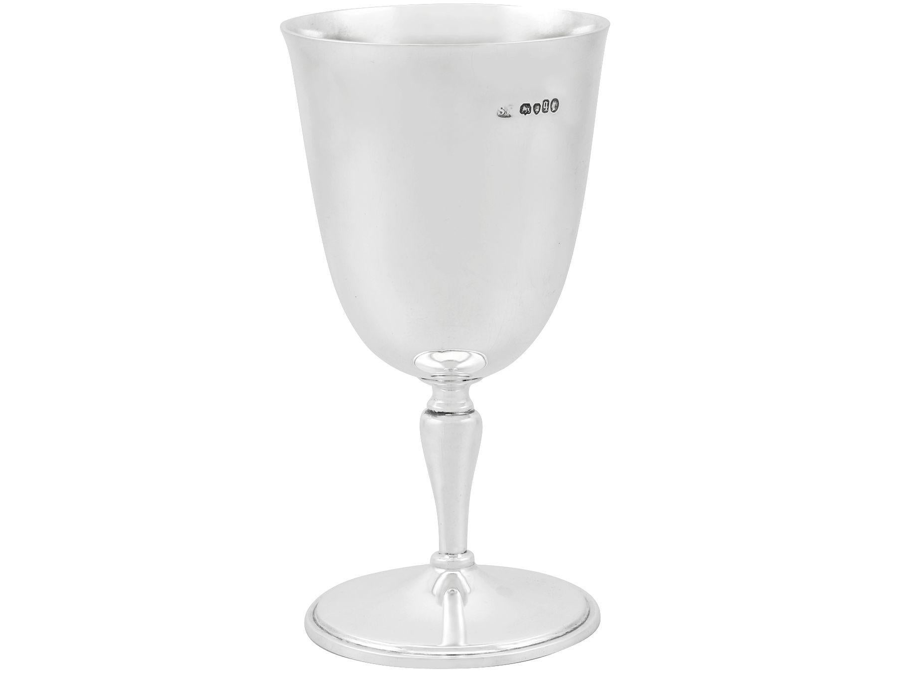 An exceptional, fine and impressive antique Victorian English sterling silver goblet, an addition to our wine and drinks related silverware collection.

This exceptional antique Victorian sterling silver goblet has a plain bell shaped form onto a