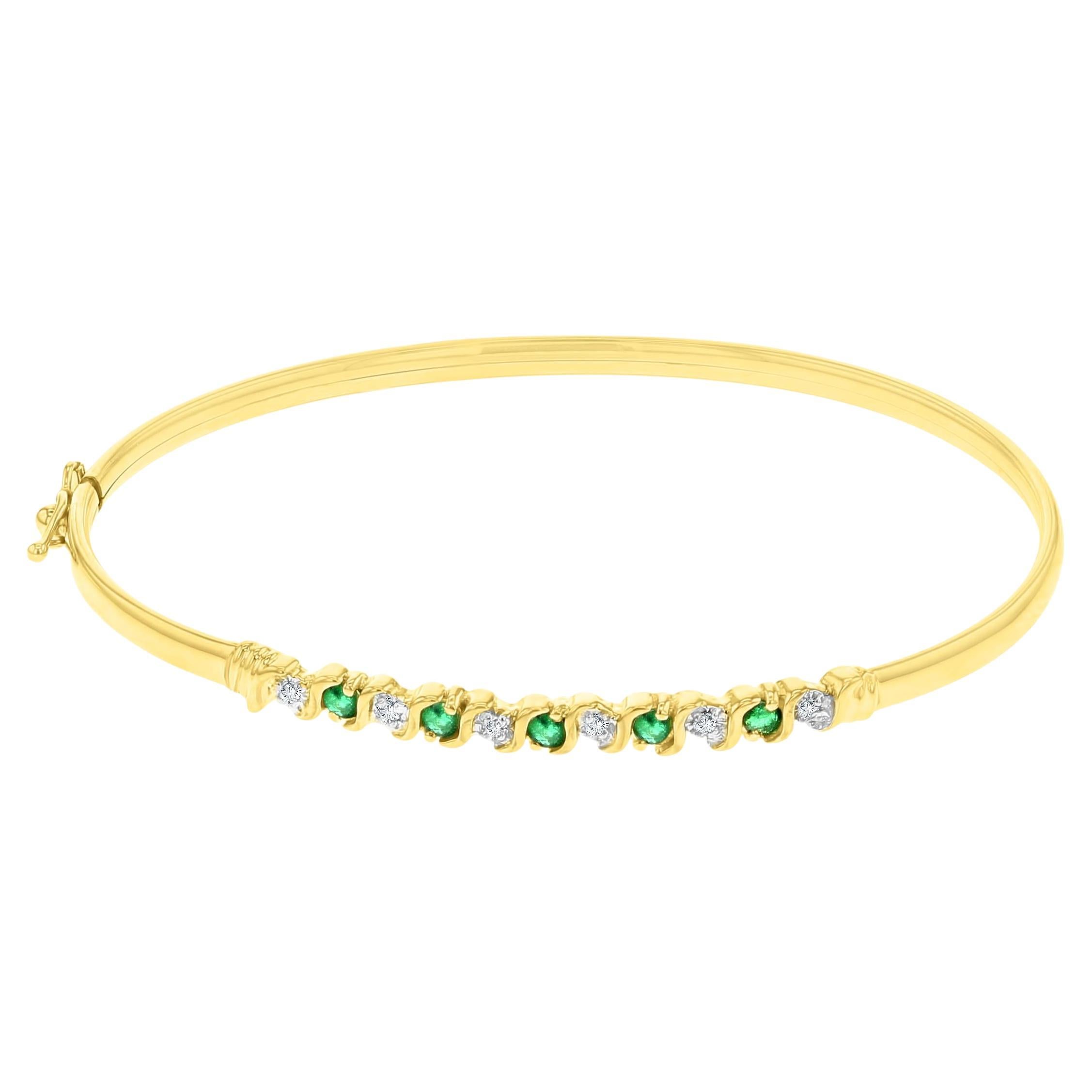 Bangle con diamante e smeraldo in stile S in oro giallo 14K in vendita