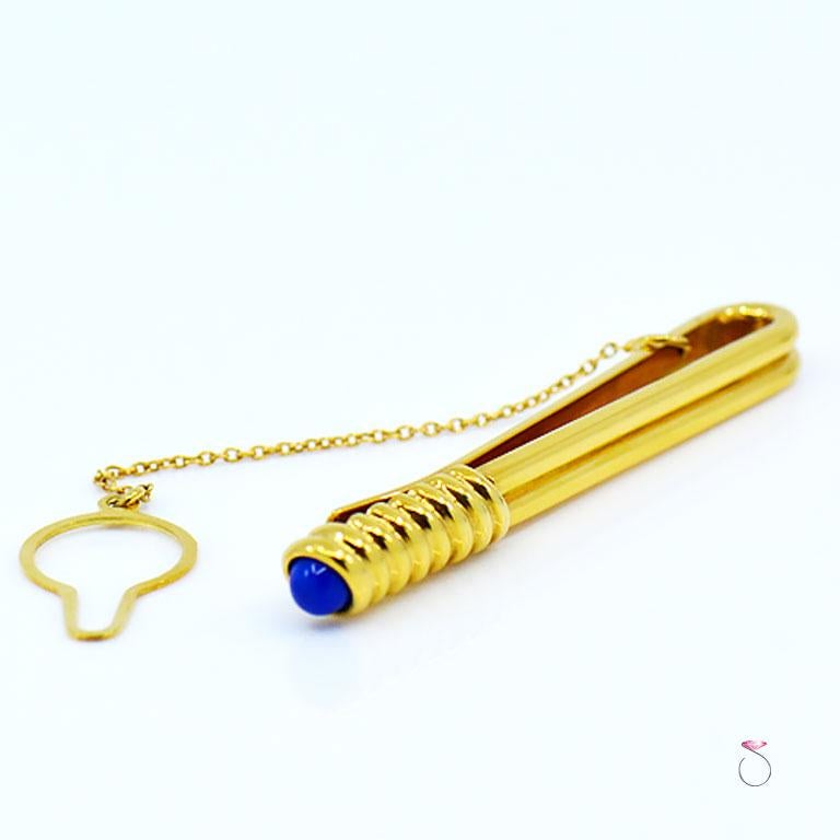 Very elegant authentic S. T. Dupont tie pin bar clasp in 18K yellow gold With Lapis Lazuli. This tie bar is beautifully designed and crafted in 18K with a double bar that leads to a rope design that holds one Lapis Lazuli bead at the end. The tie