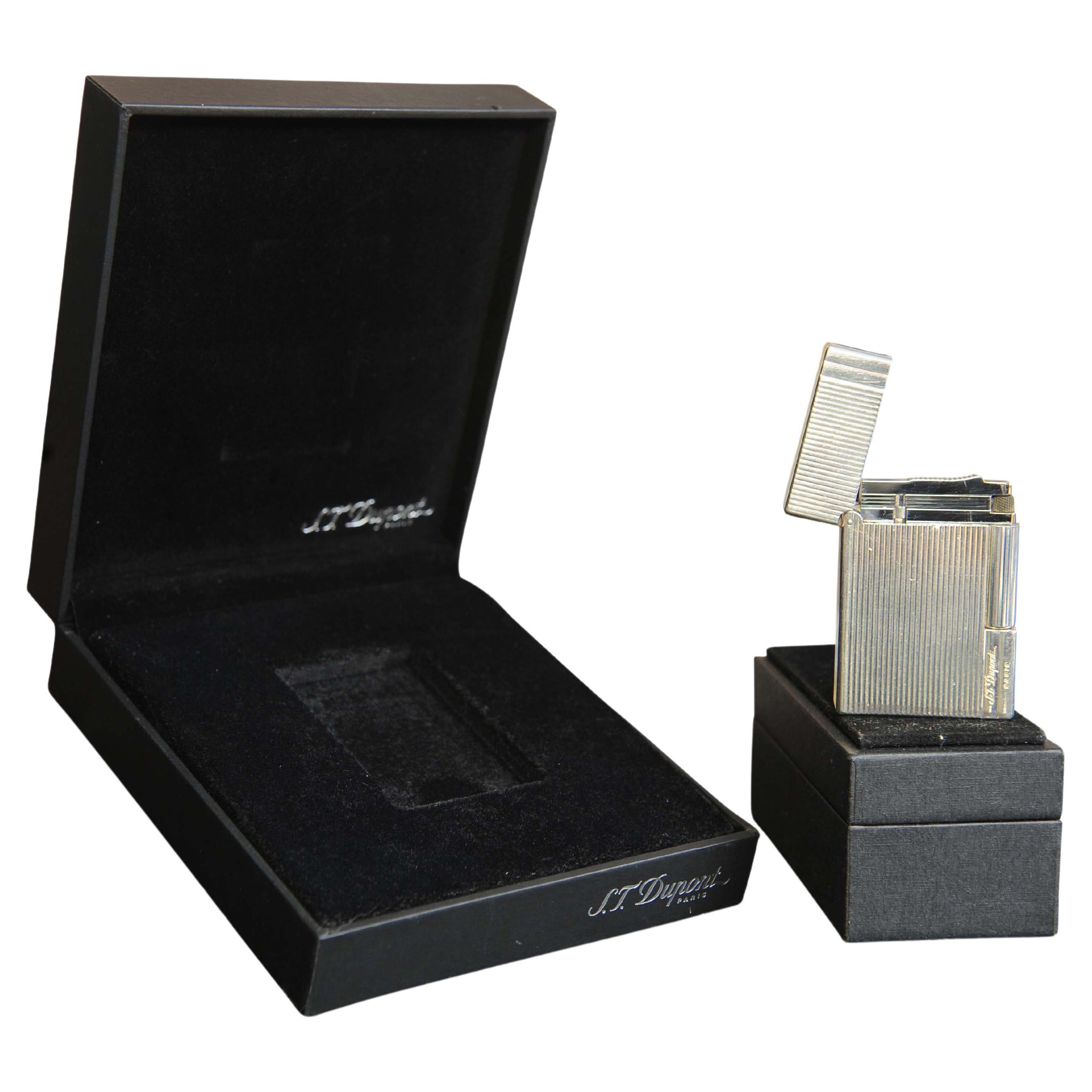 S. T. DuPont Gatsby Paris Cigarette Lighter with Original Box and Papers

Booklet stamped at purchase 2016

Stamped 1LY8N84 DuPont PARIS, Made in France on base.

