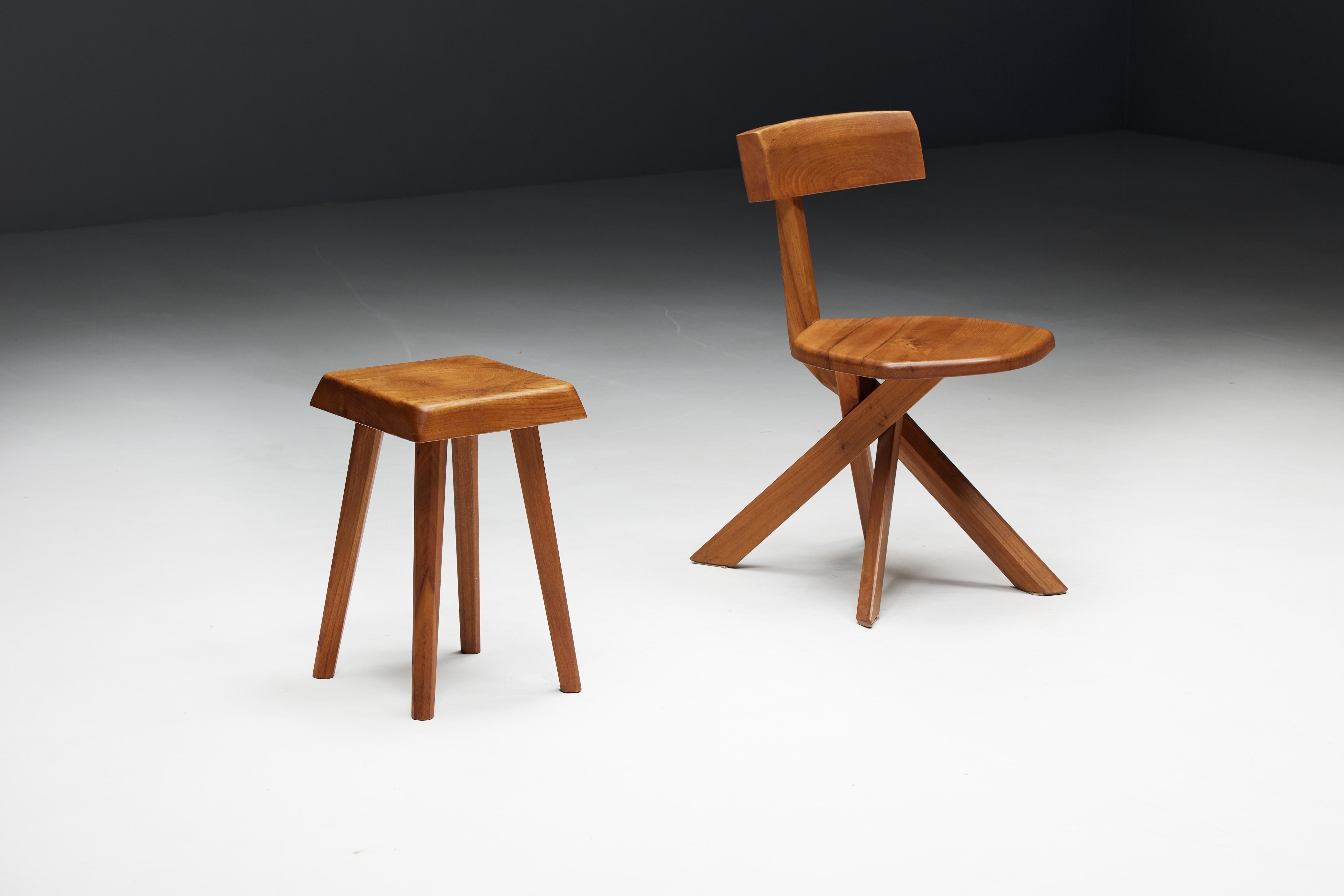 S01 stool by Pierre Chapo in solid elm wood. This stool is crafted with precision in 1970s France. It features four sturdy feet and a square seat featuring rounded and angled edges. Explore our other Pierre Chapo listings for complementing pieces,