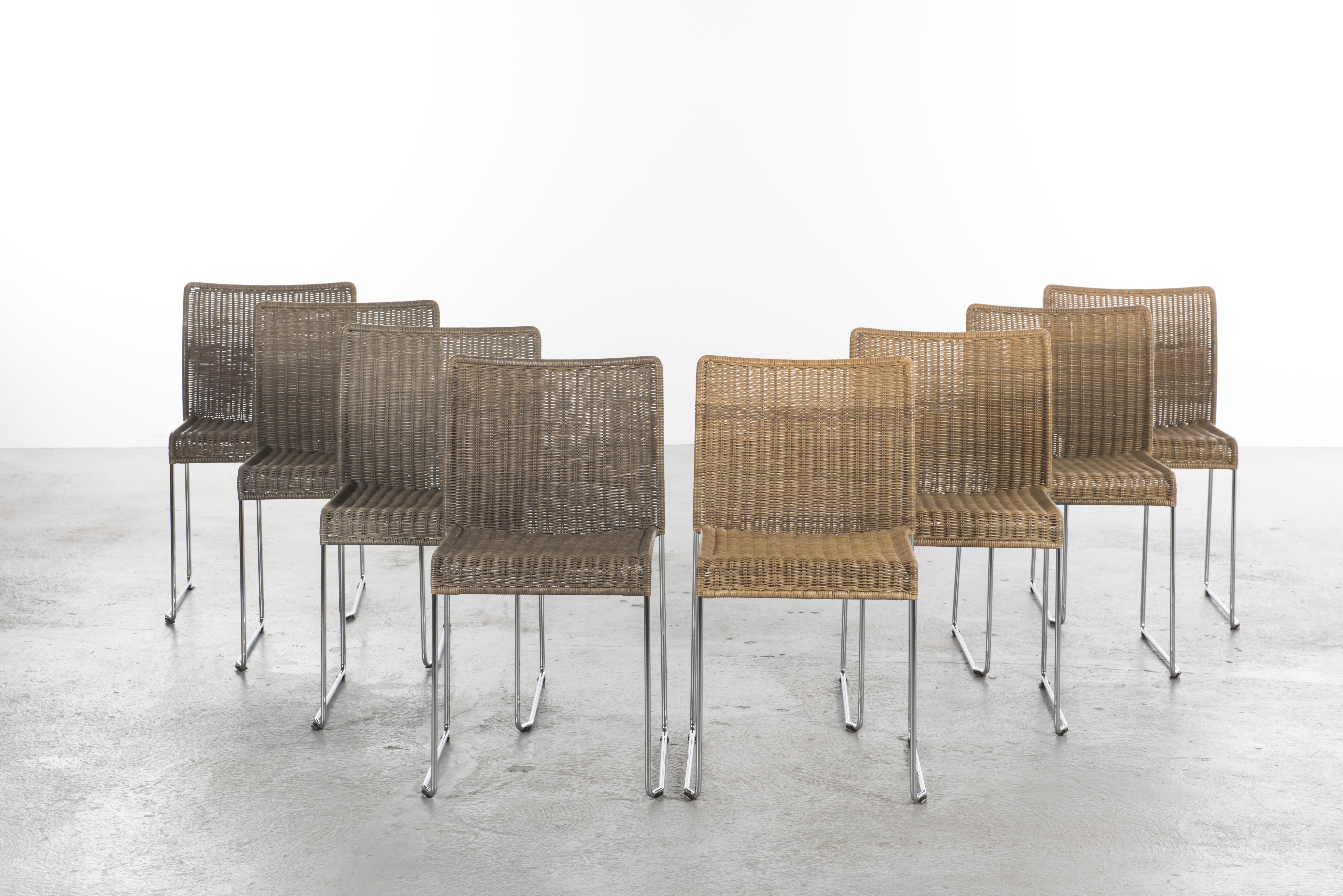 Set of eight dining rattan chairs model S 21 by Tito Agnoli for Pierantonio Bonacina.
Very comfortable continuous seat and back in natural rattan, colored for 4 chairs and a frame in chromed stainless steel.
The chairs can be stacked.
 