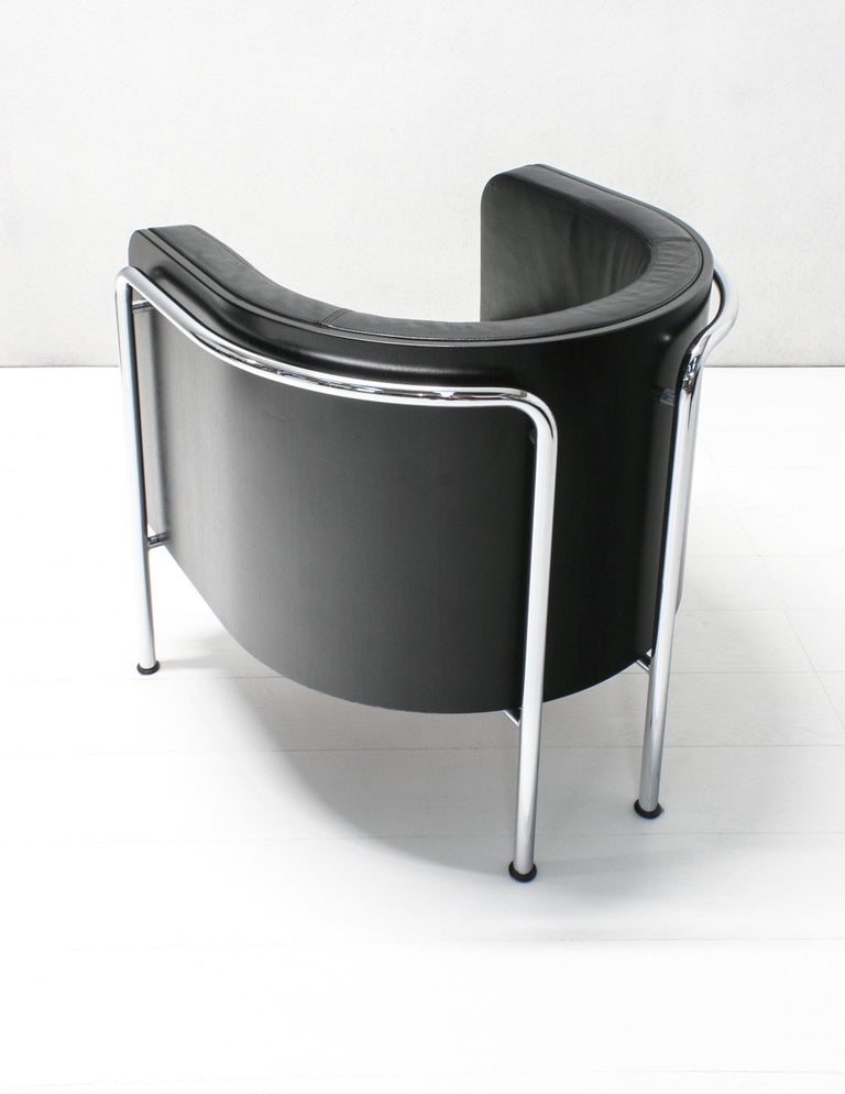 A stylish comfortable, heavy club chair model S3001 designed by Christoph Zschocke in 1990s and produced by Thonet Germany. The soft black leather upholstery is surrounded by bent black stained beech plywood and supported in a chromed frame of