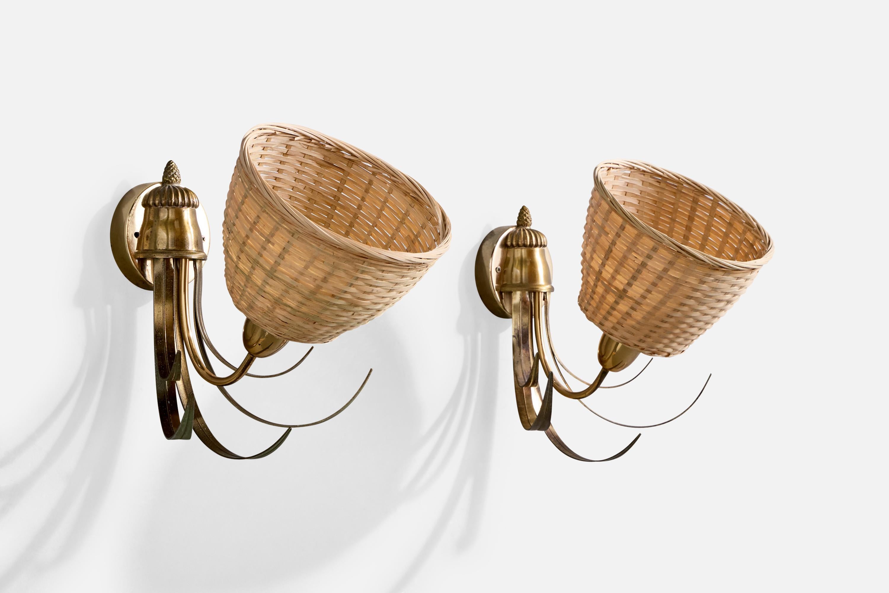 A pair of brass and rattan wall lights designed and produced by S.A. Boulanger, Belgium, c. 1970s.

Replaced lampshades.

Overall Dimensions (inches):  10” H x  7.75” W x 11.75” D

Back Plate Dimensions (Inches):  3.5” H x 3.5” W x .875” D

Bulb