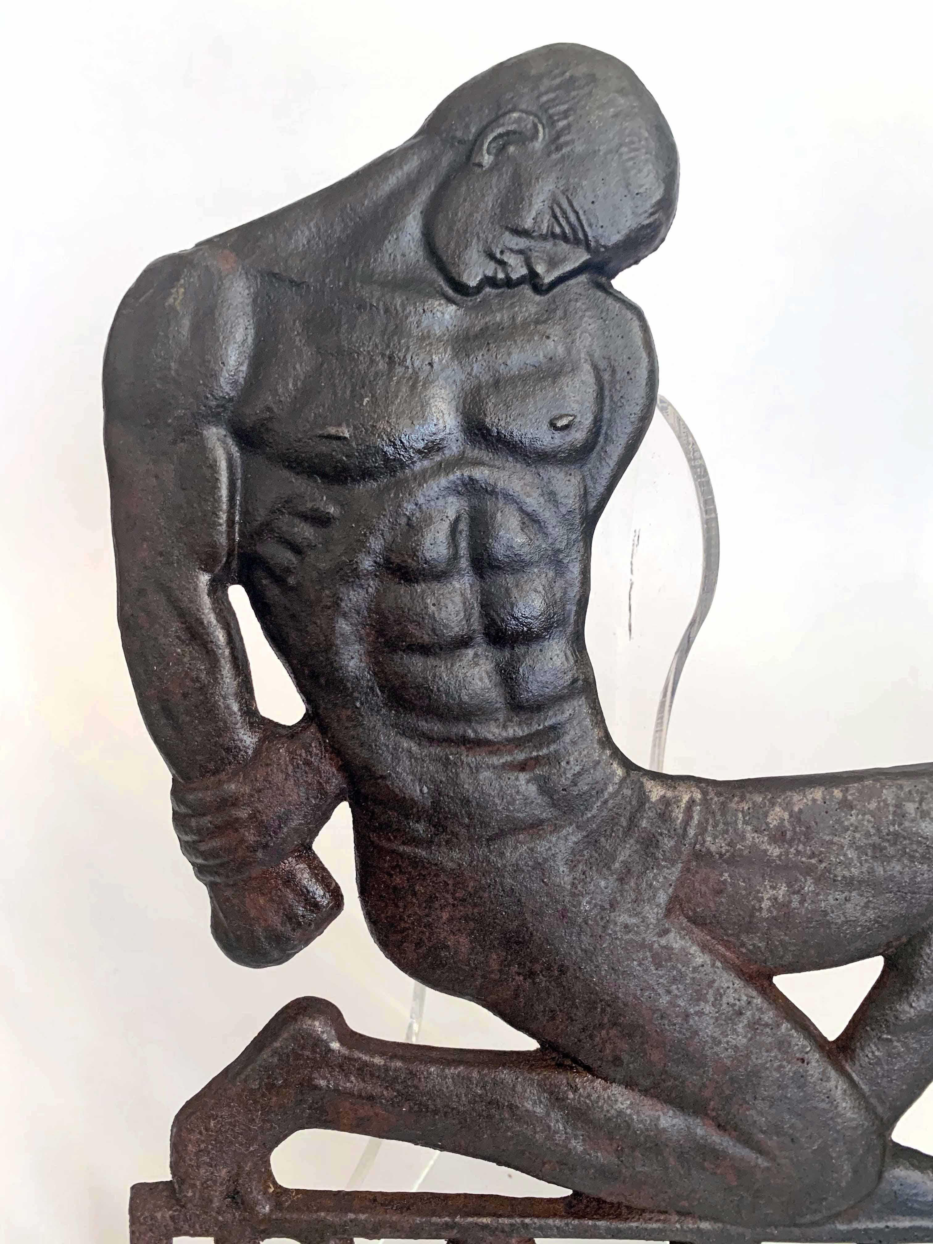 Extraordinarily rare, and perhaps unique, this Art Deco-Moderne sculpture of a kneeling, nude male figure, clearly representing the workers of the coal mining and manufacturing Saar region of Germany -- was cast in iron in 1935. The Saar was