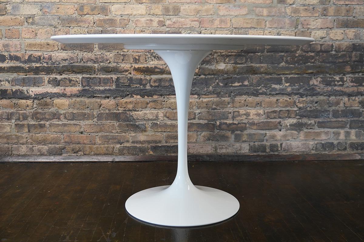 Designed by Eero Saarinen in 1956, the tulip table is a standout; it's practicality and beauty have ensured that it has been in production ever since it's mid-century debut.  

It was named 