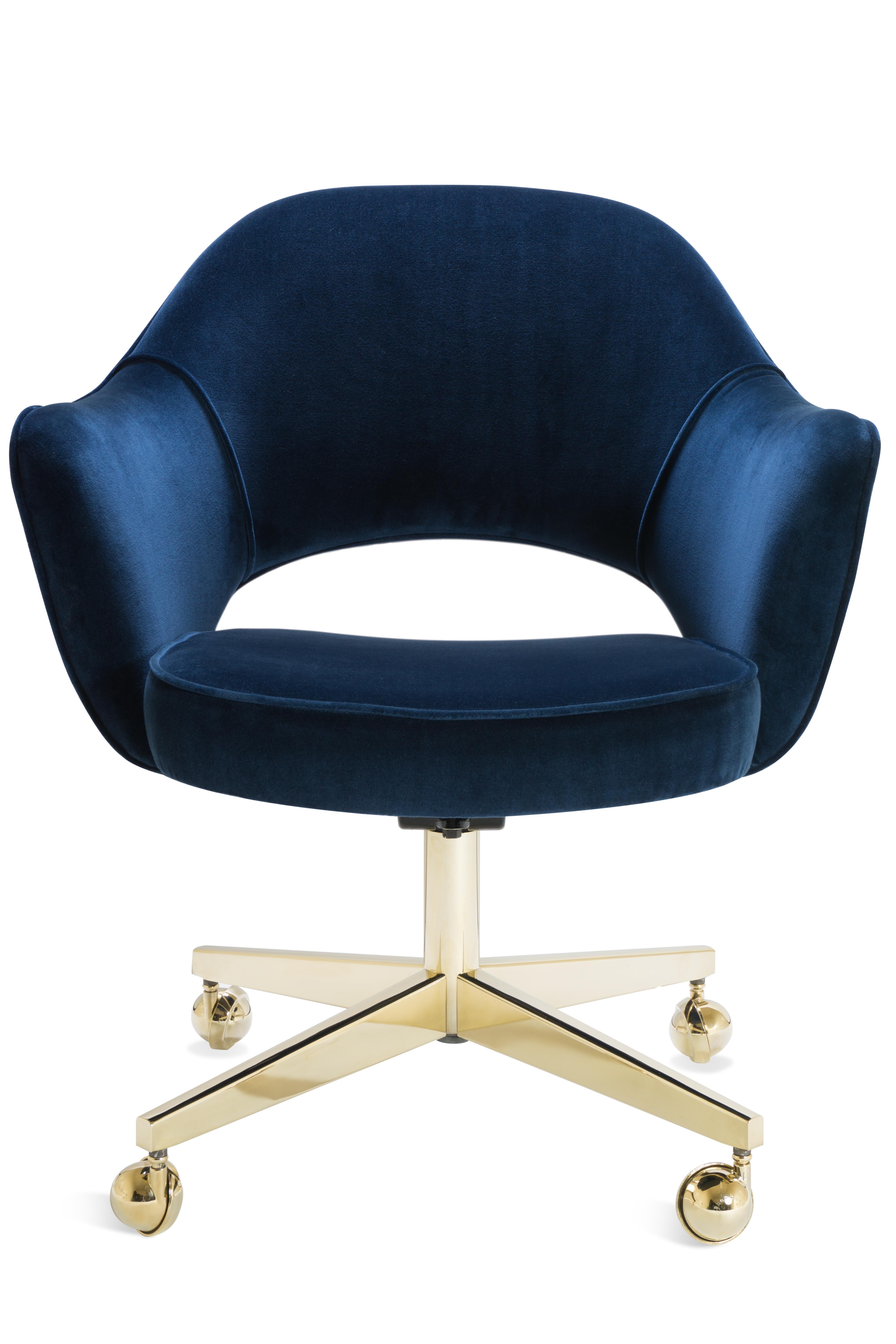 Masterful restoration of 100% authentic Saarinen executive arm chair executed in line with original specifications. In addition to new fabric in stunning navy Italian velvet, the foam in the chair is replaced as well. This chair features a vintage
