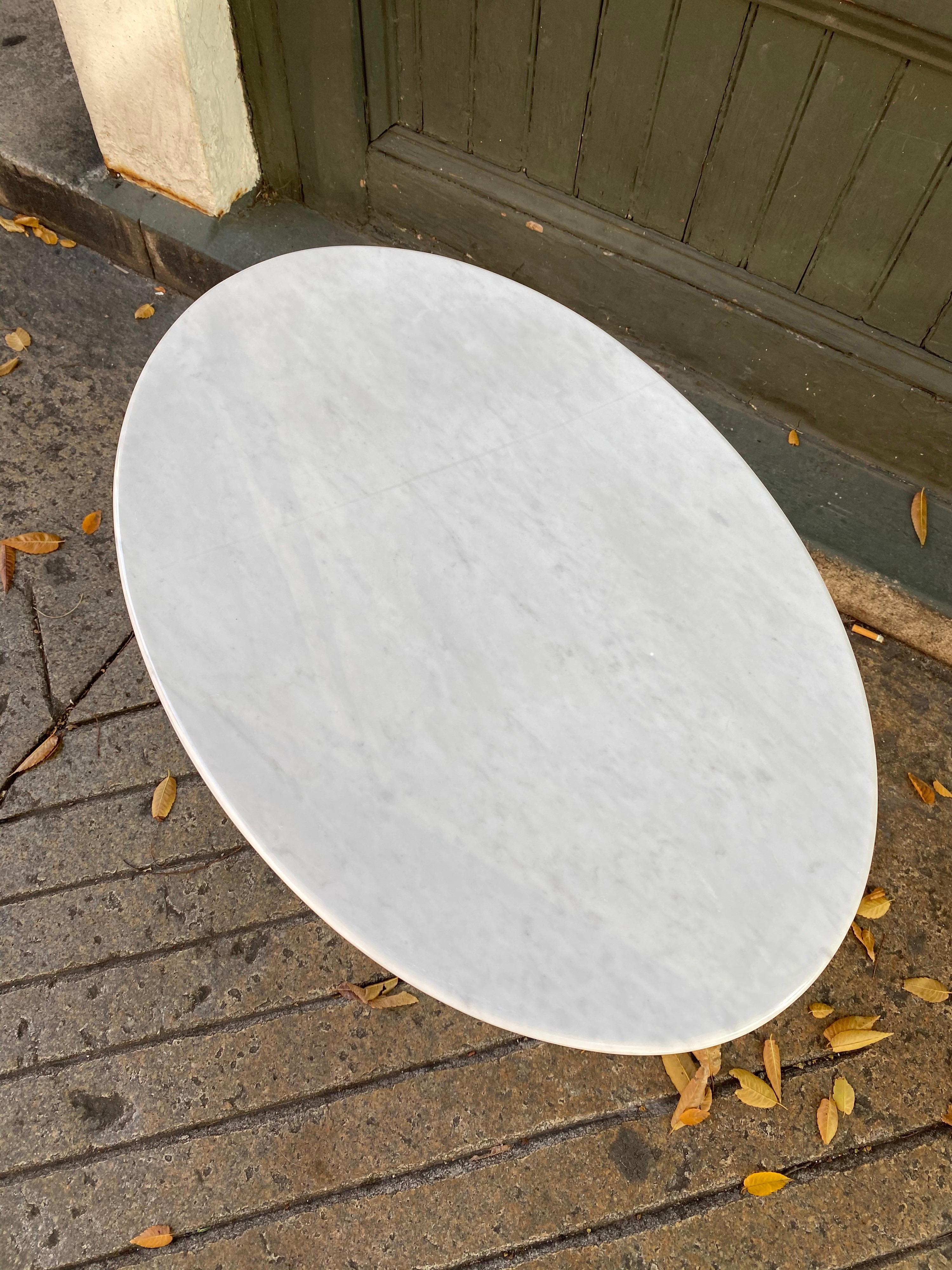 Saarinen for Knoll oval marble top table. Marble has just been professionally polished and looks great! Classic little table that fits easily into any decor! This one is probably about 10 years old. Base is very clean and retains a partial Knoll