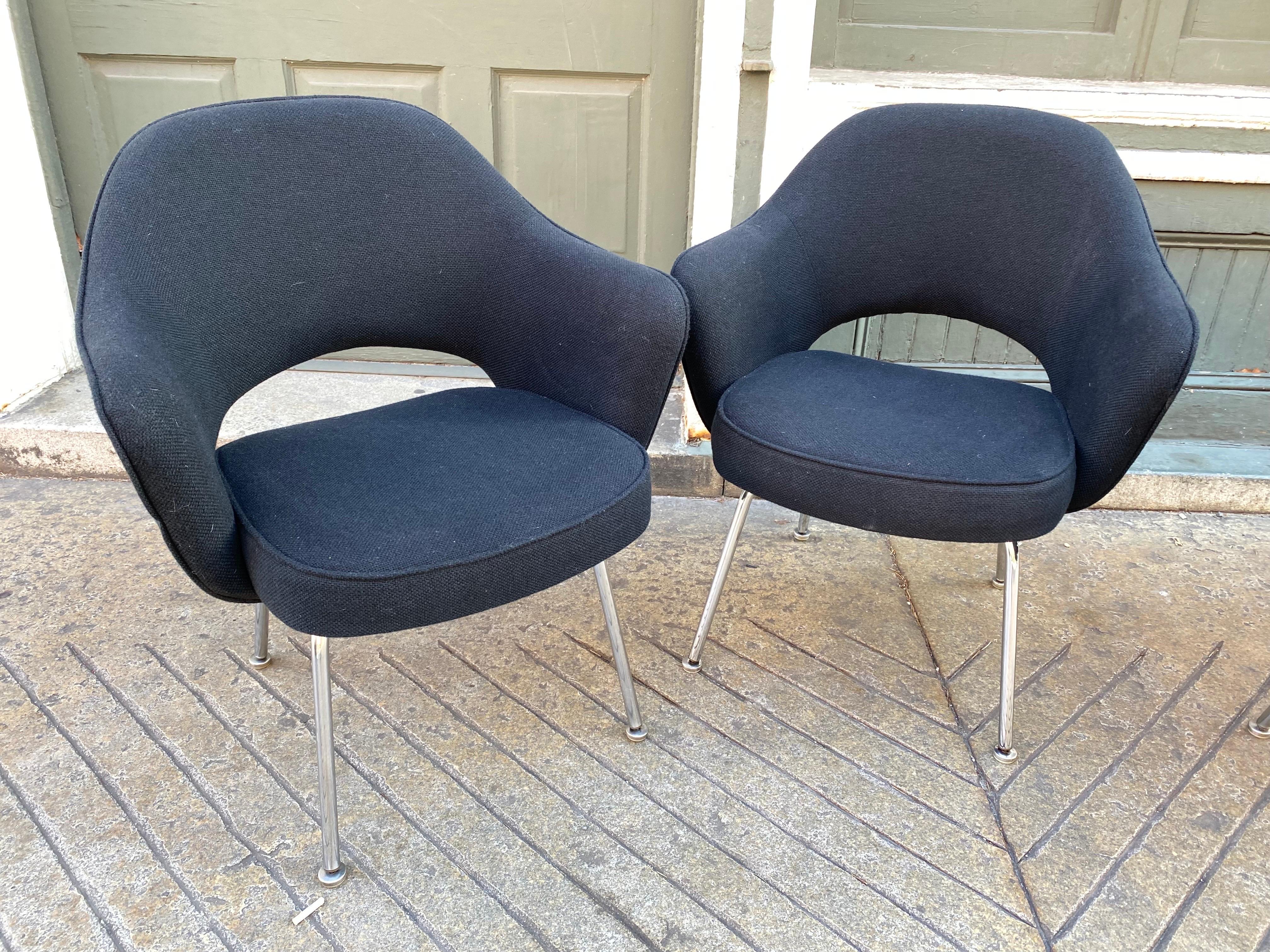 Set of 4 executive armchairs designed by Eero Saarinen for Knoll. Design dates to 1948. These examples are probably from the 1970's or 80's. They have tags showing they were reupholstered in 1991. They look very good still, just cleaned. Foam in