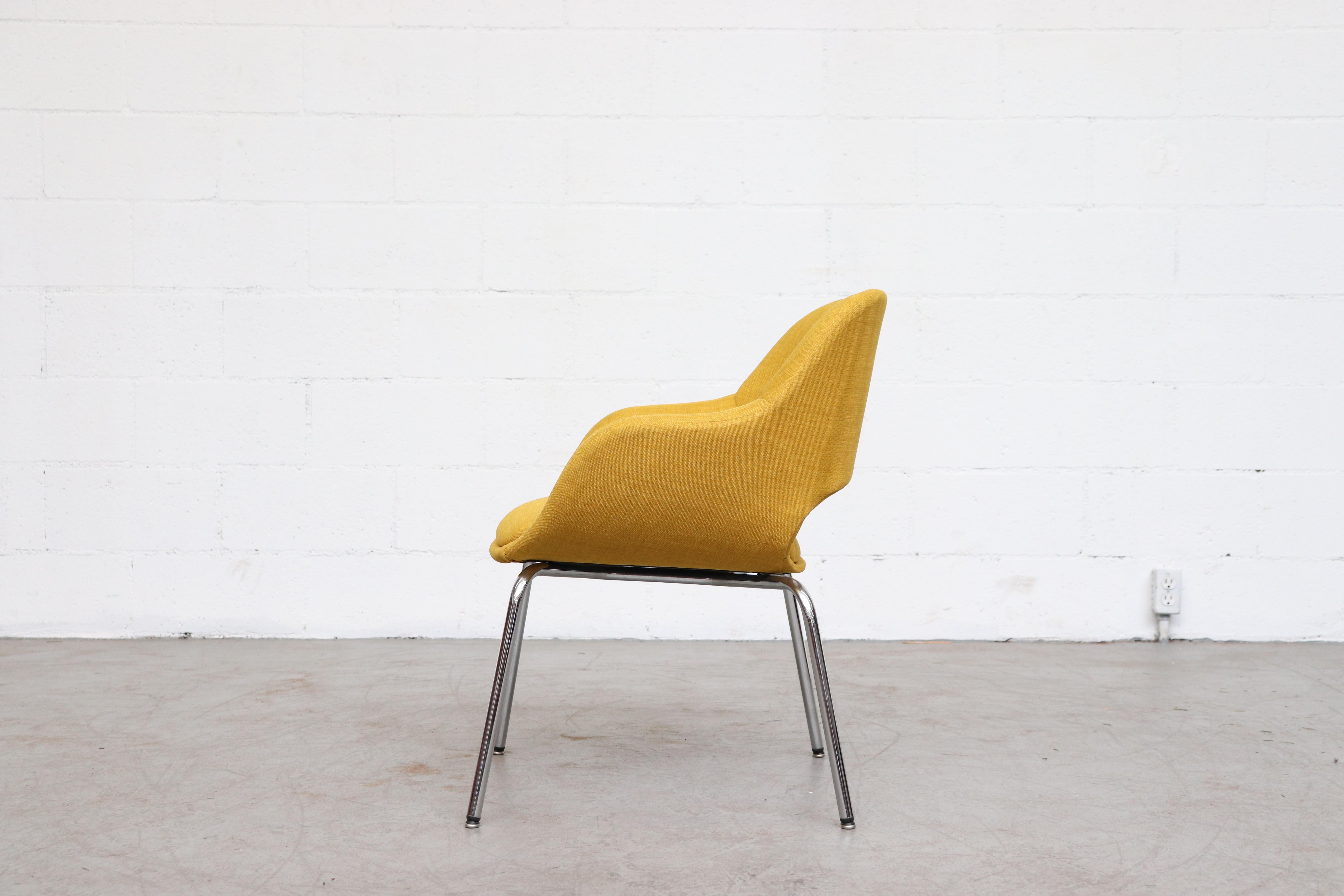 Saarinen style armchair, newly upholstered in sunshine yellow fabric. Attributed to AP Originals by Hein Salomans, Netherlands, 1970. Lovely cut-out back and curved chrome legs. Frame in original condition with some signs of wear consistent with