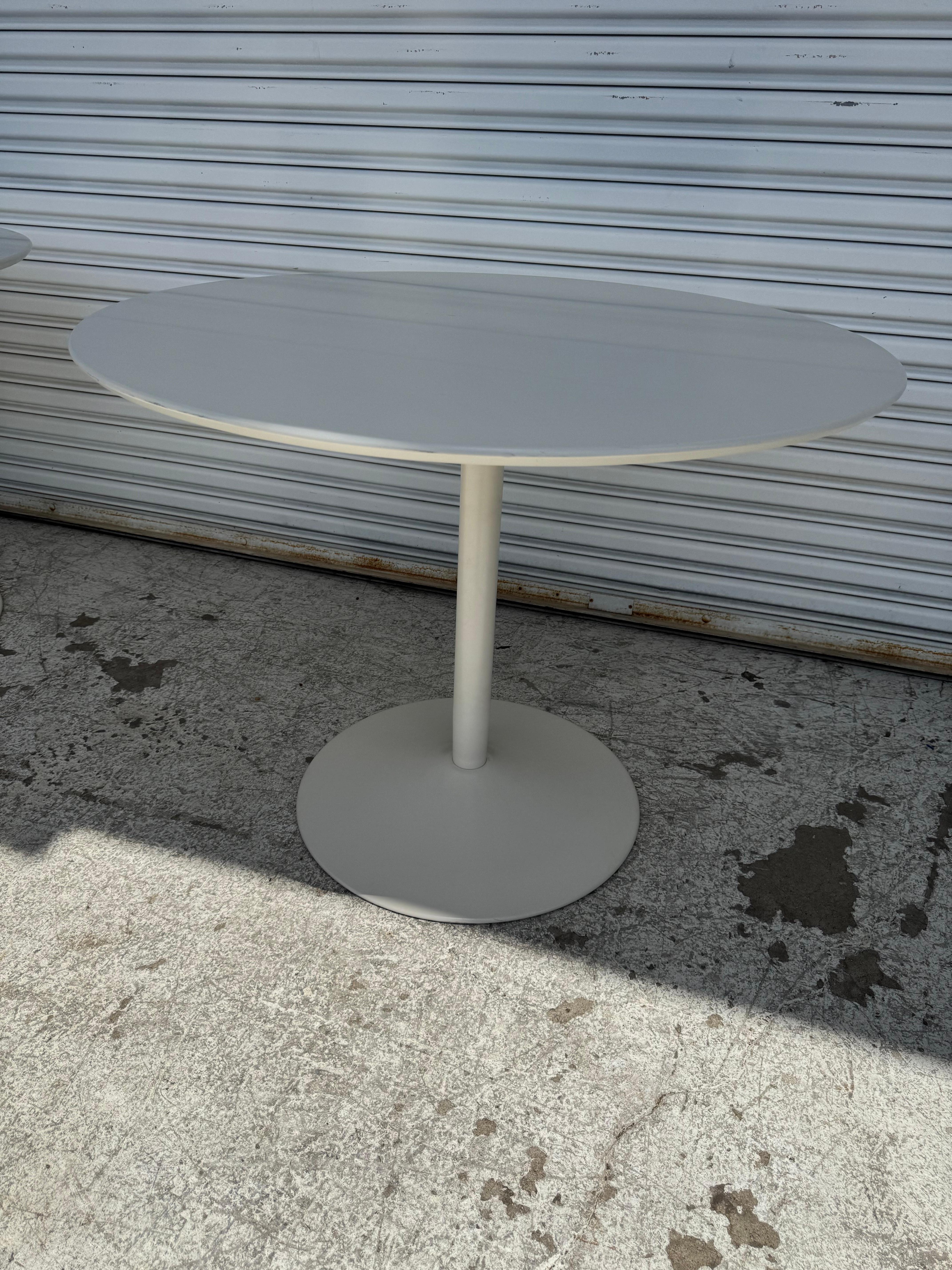 This is a Tulip Pedestal Base Dining Table, .