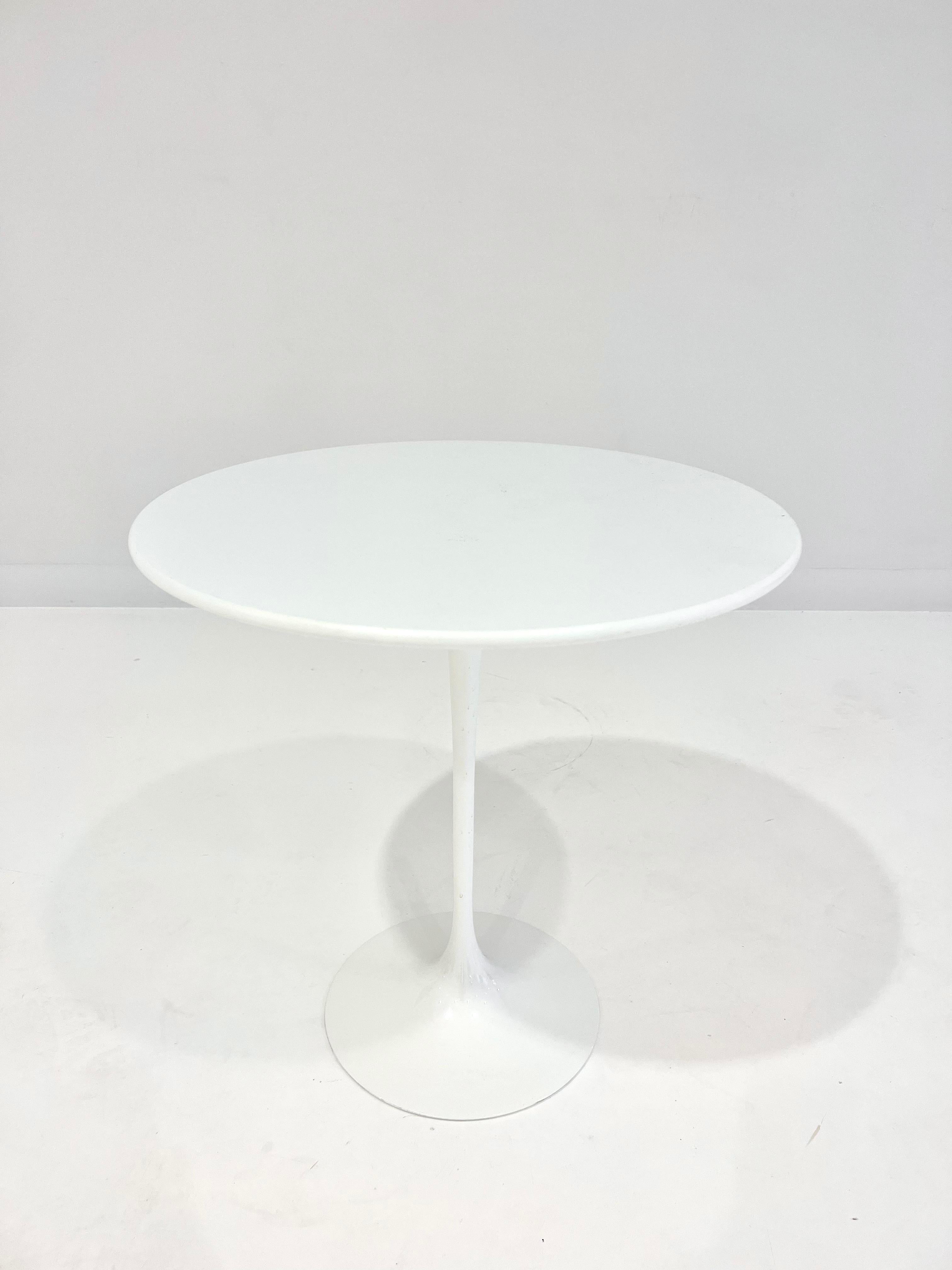 Authentic Eero Saarinen's signature white pedestal Tulip Table by Knoll Studio, with laminate top and cast-aluminum base, 1956.
Signature plate on the underside.
**List Price: $1,400/EACH (Two available)
