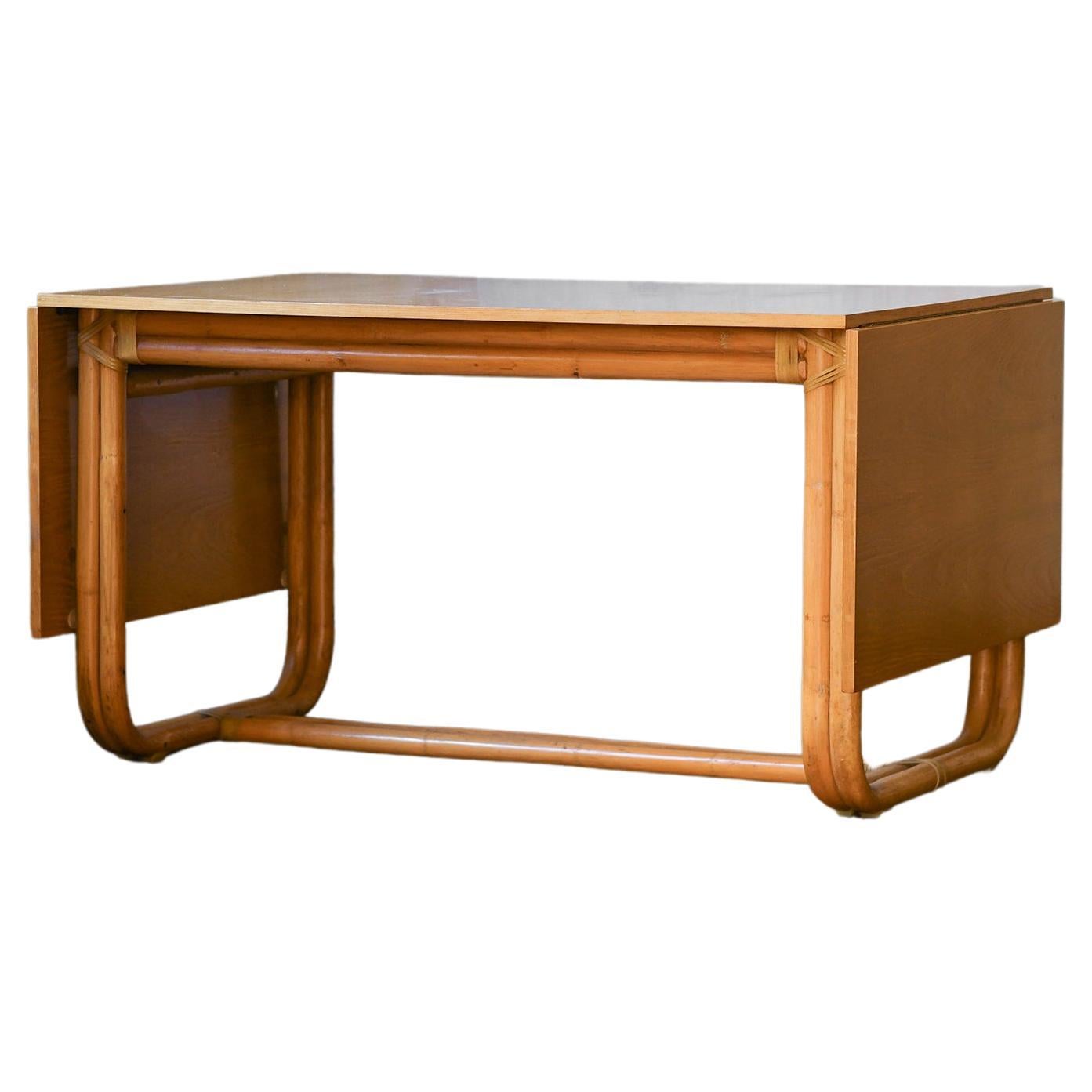 Sabatin bamboo table with extendable wooden shelf and leather bindings For Sale