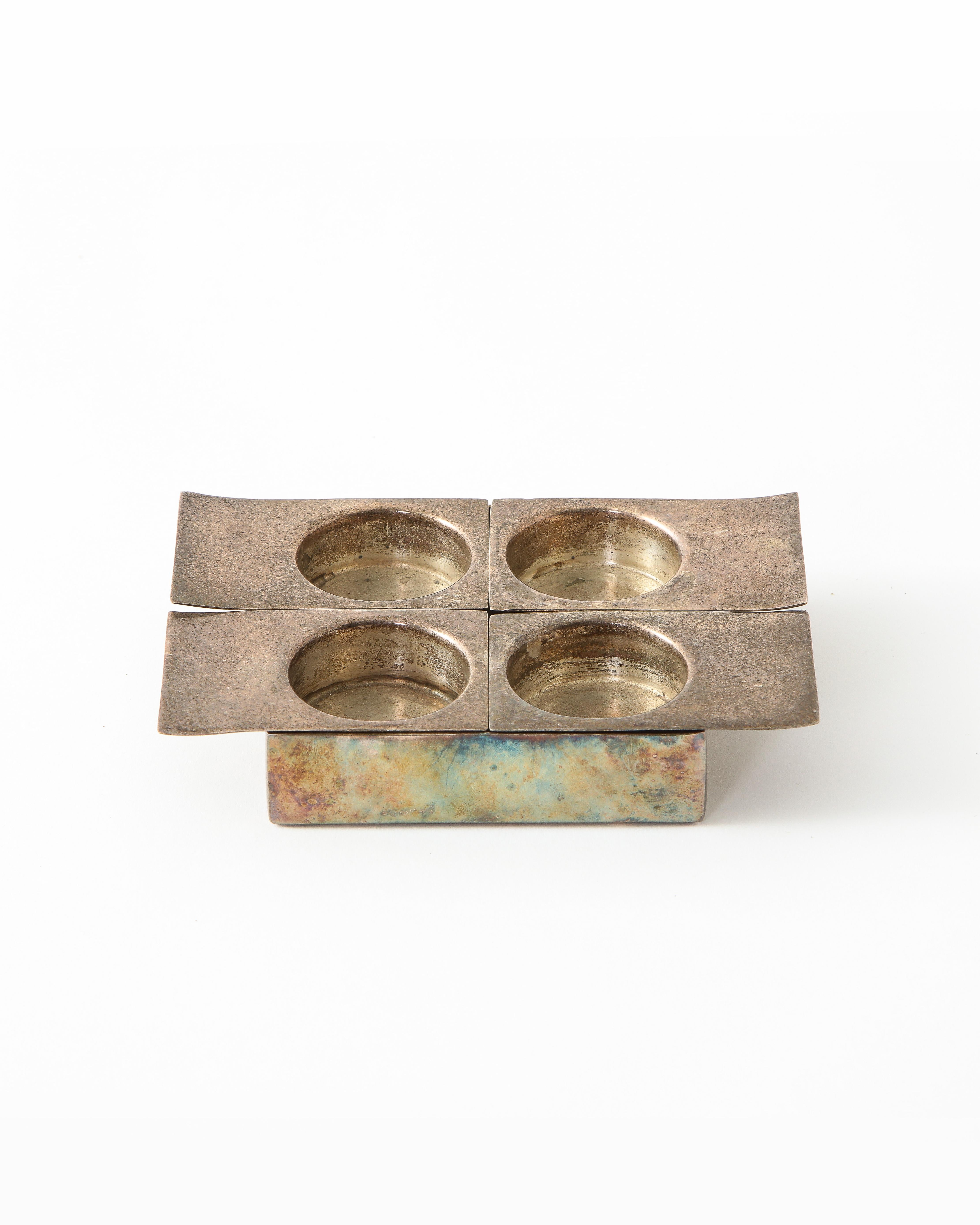 Petite silver plated square tray possessing four removable units each imprinted with a deep circle.

In the style of Lino Sabattini. Impeccable patina.