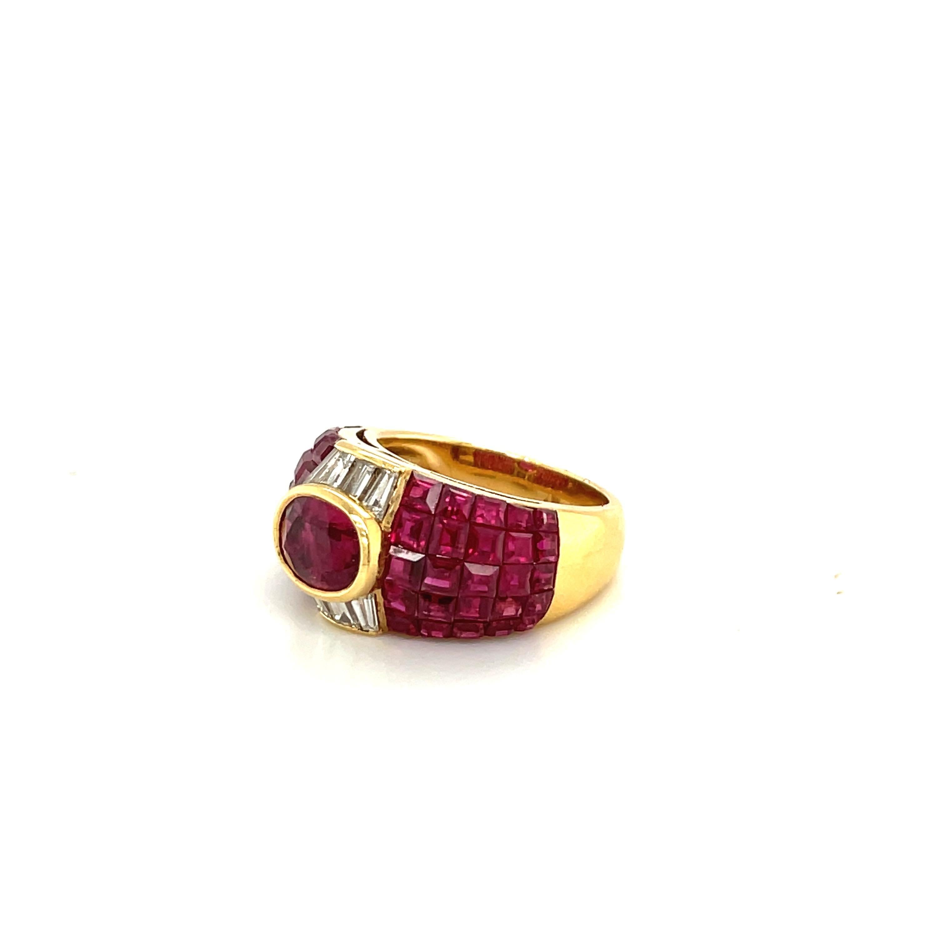 Created by the famed jewelers Sabbadini of Italy, this 18kt yellow gold ring is in their classic style. Vibrant invisibly set square cut rubies highlight the center bezel set oval ruby. Diamond baguettes frame the ruby on either side.
Total ruby