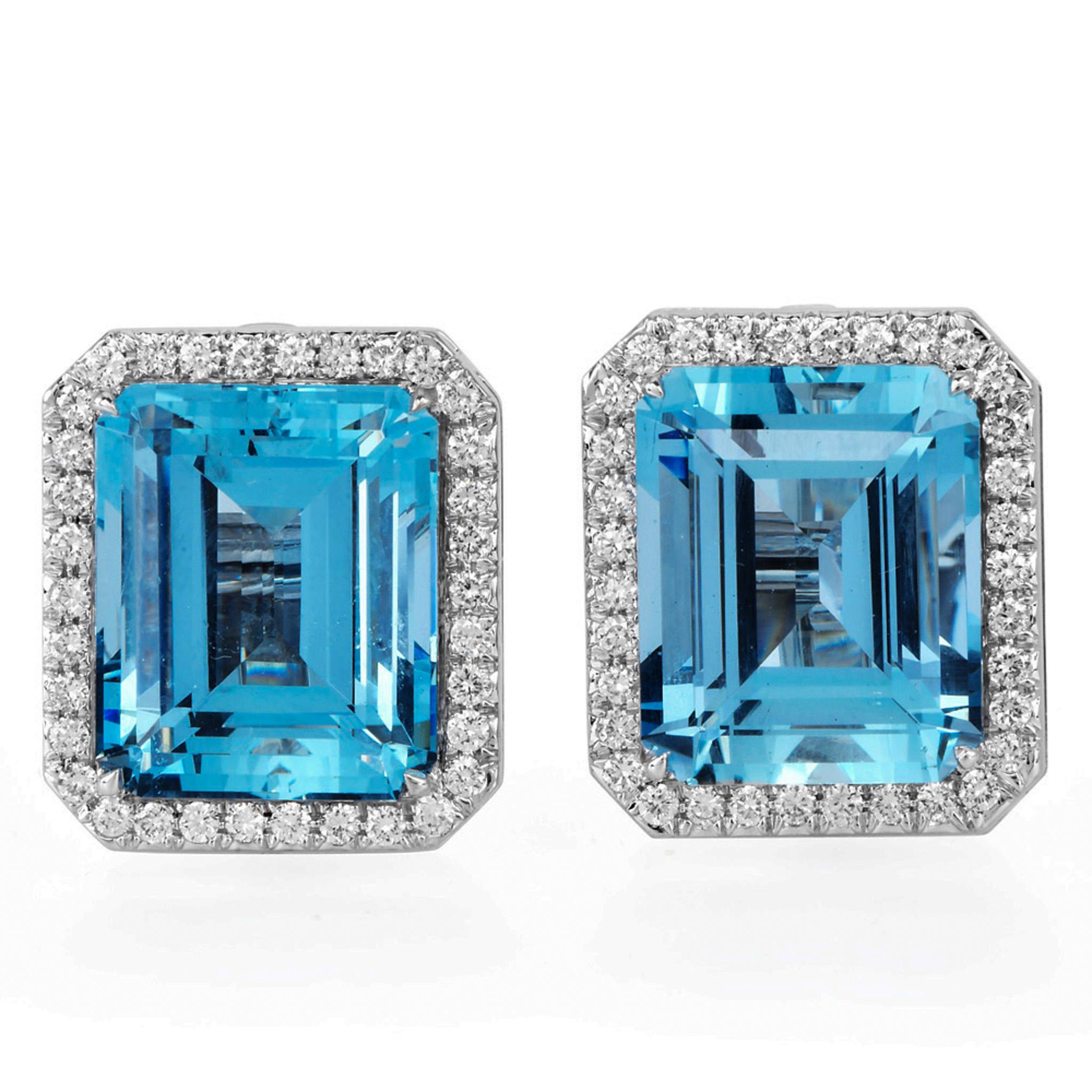 Admire these angelic Sabbadini Diamond Aquamarine Clip-on 18k gold earrings, These large emerald-cut ocean blue Aquamarines measure 16mm by 14 mm and weighing approximately. 29.00 carats in total

The Aquas are surrounded by numerous round-cut