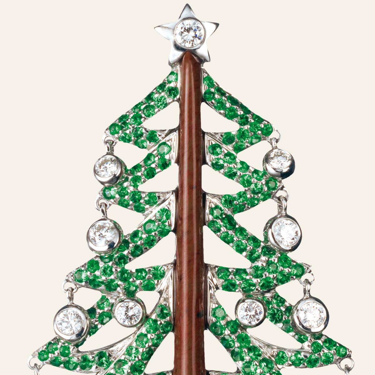 Sabbadini Christmas Tree Brooch In Diamonds & Green Garnets 
18k White gold 'christmas tree' brooch, jasper, diamonds 1,78ct and green garnets 5,49ct. Gold 21,60gr
Hand made jewelry & designed in Milan, in Via Montenapoleone.
This item comes