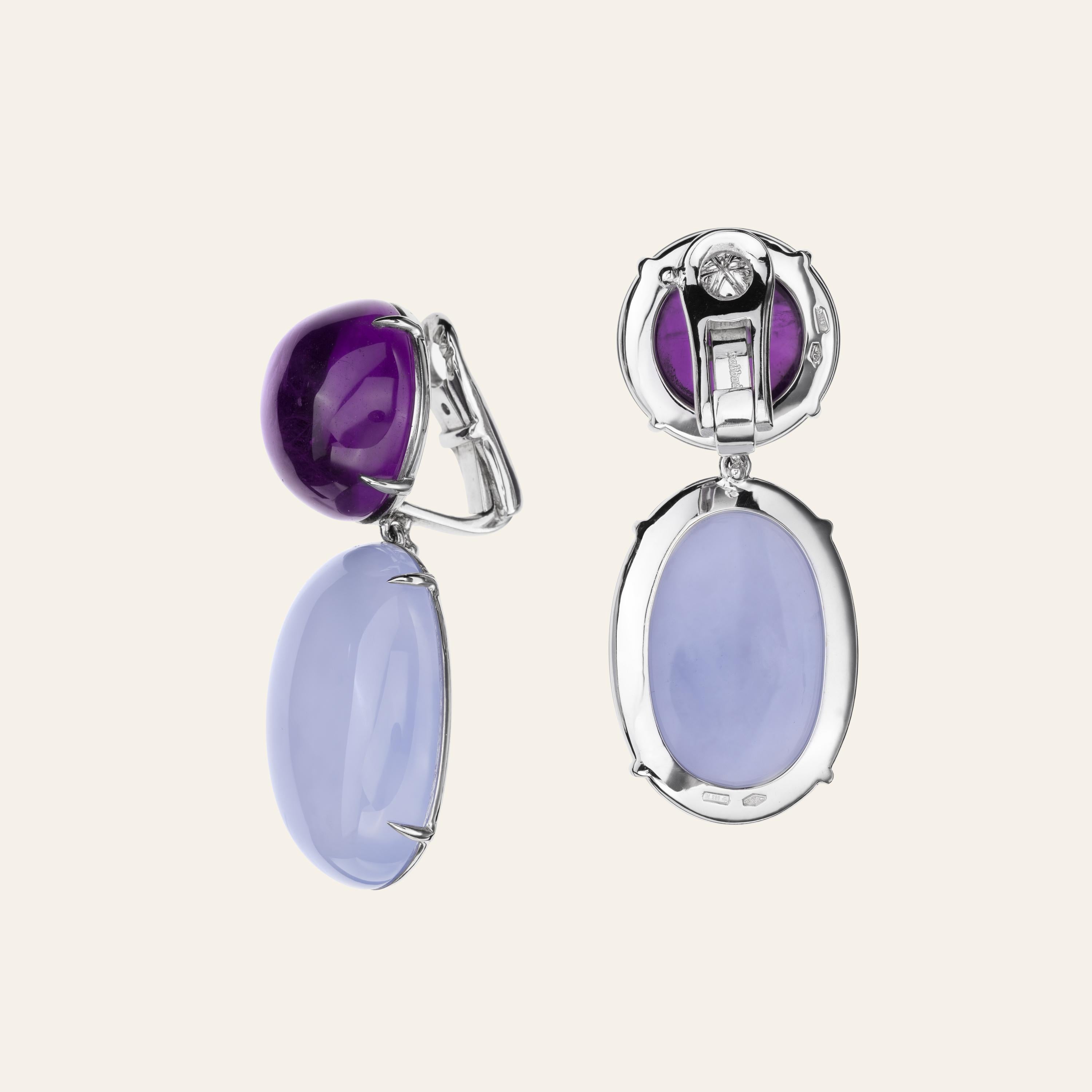 Sabbadini Cocktail Earrings With Amethyst And Chalcedony 
18k White gold earrings, round cabochon amethysts 30,34ct and oval cabochon chalcedony 50,51ct. Gold 15gr
Hand made jewelry & designed in Milan, in Via Montenapoleone.
This item comes