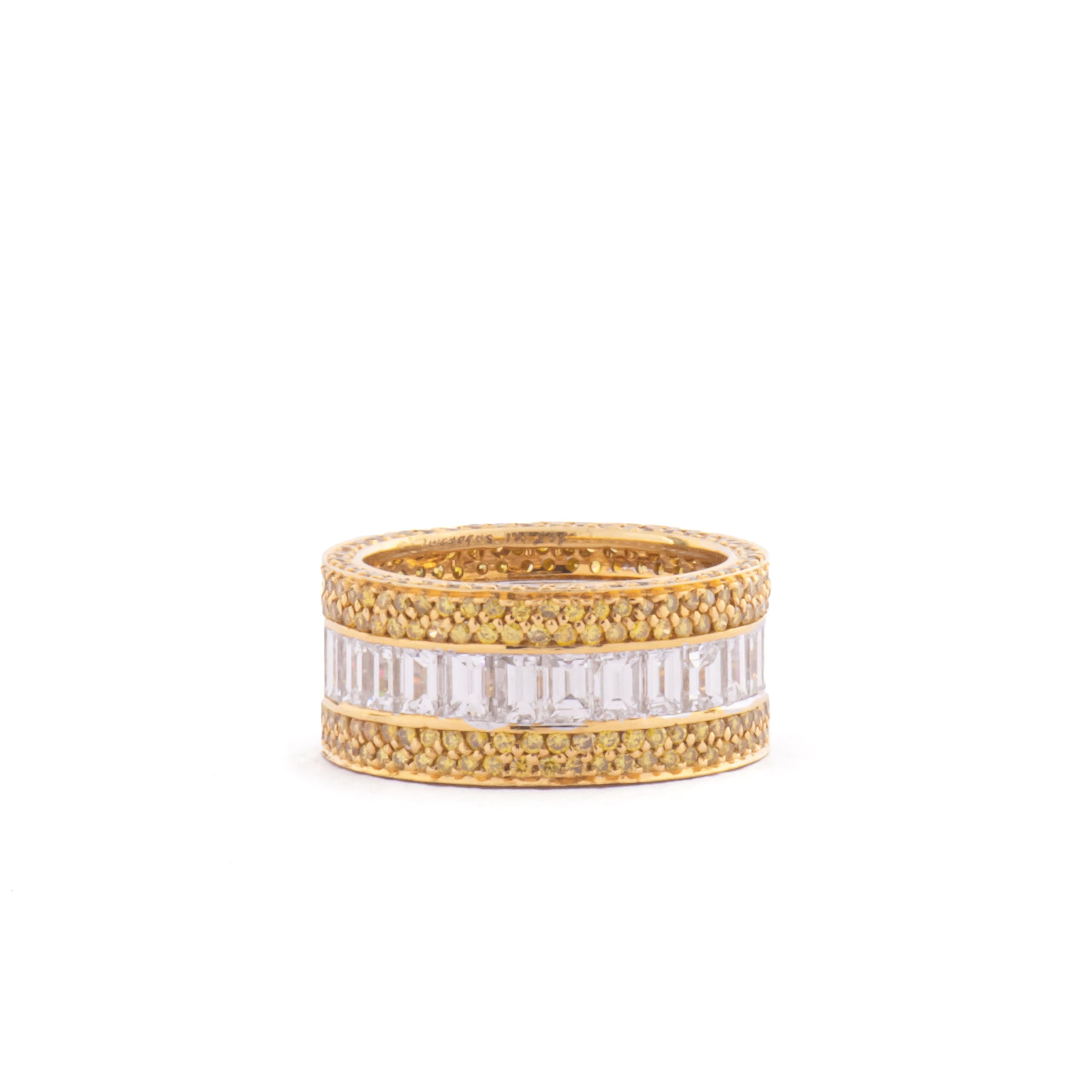 
A stunning band that shines on its own or can be stacked with other rings.
White and yellow band 18KT  gold with baguettes diamonds F/G color ct 3,76 and fancy yellow diamonds ct 1,69.
size 13,5 Italian