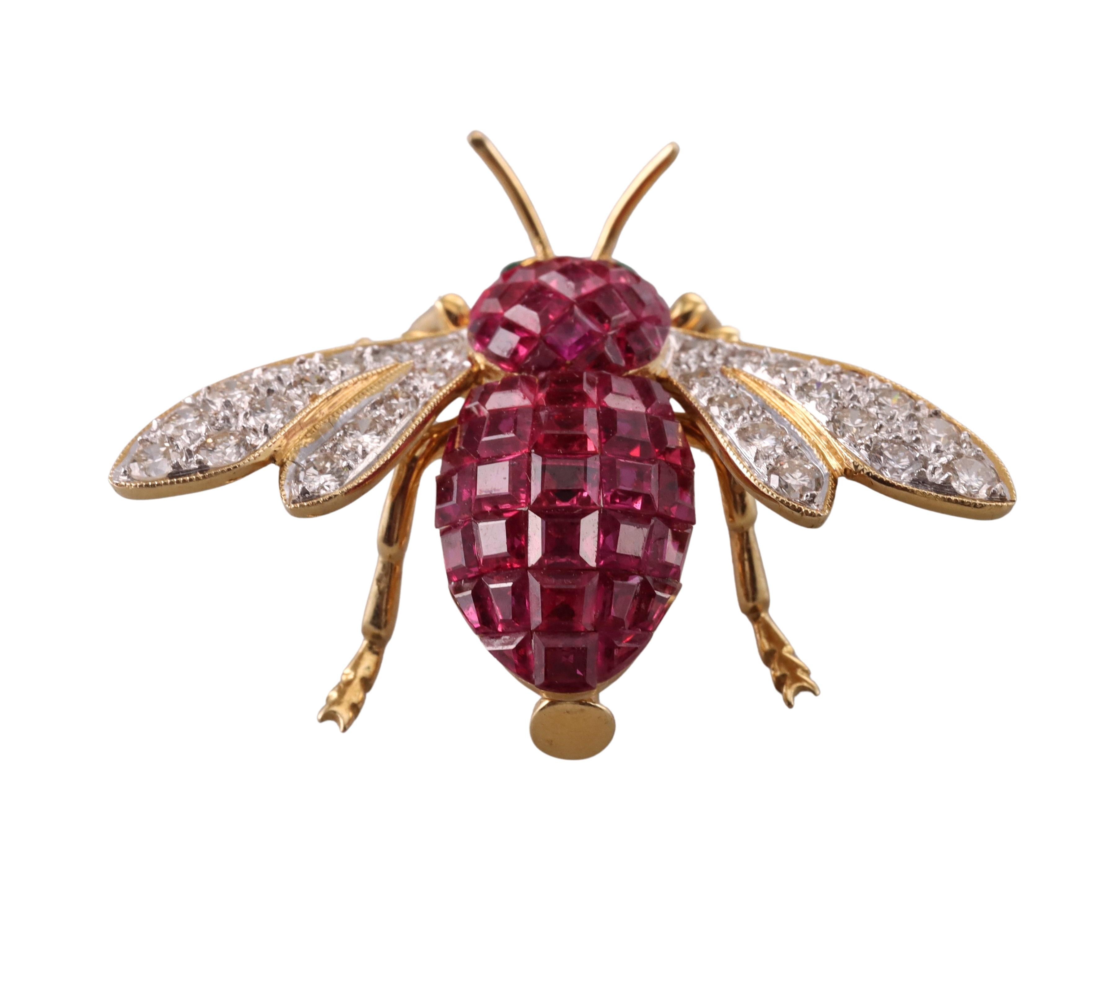 Adorable 18k yellow gold bee brooch, by Italian designer Sabbadini. Featuring invisible set rubies and approximately 0.80ctw in G/VS diamonds, with emerald eyes. The brooch measures 1 1/8