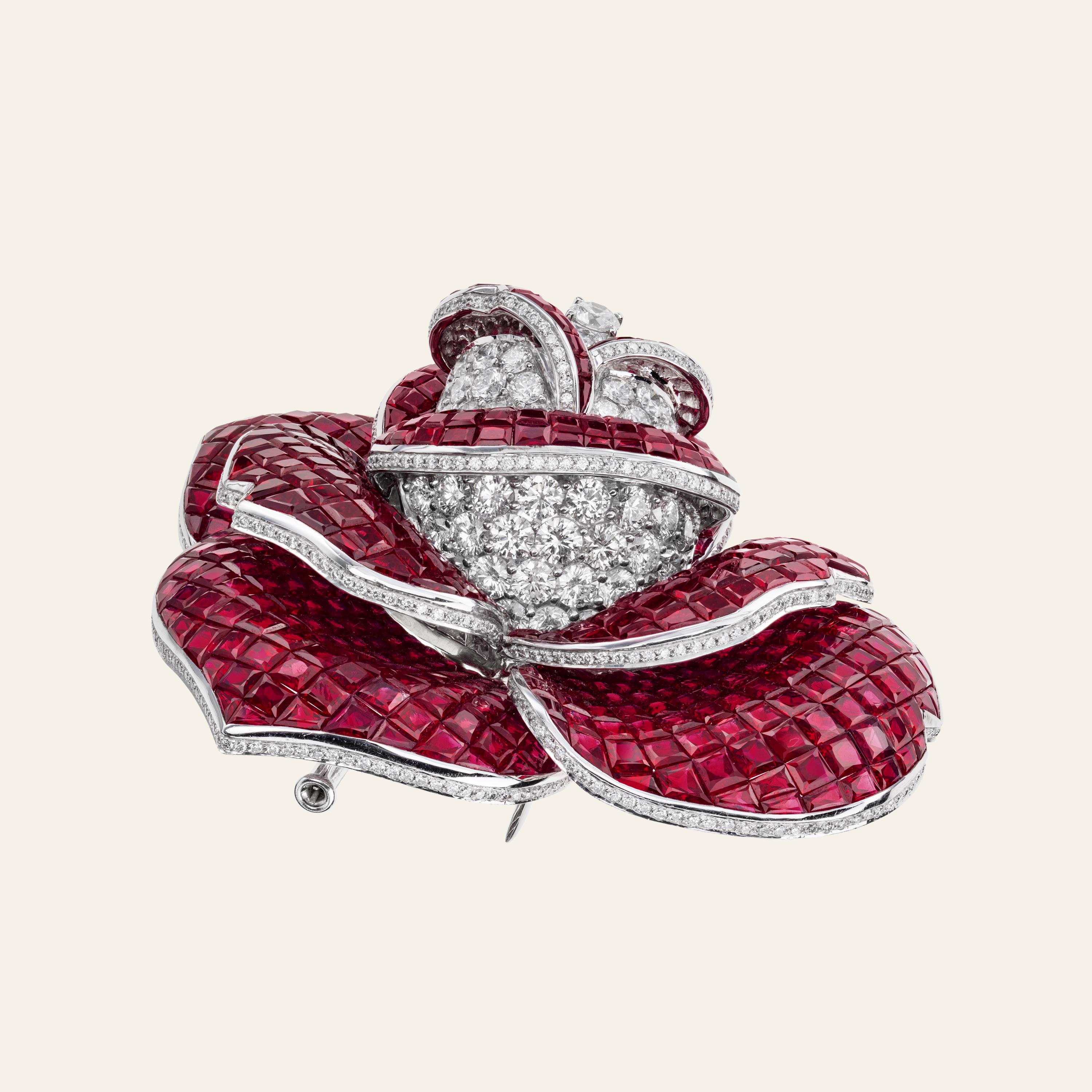 Sabbadini Invisible Setting Rose Brooch 
18k White gold rose brooch, diamond pavé 9,05 caratst and invisibly set Burmese Rubies 136,98 carats 
Gold 83,52 grams
Made In Italy
Via Montenapoleone