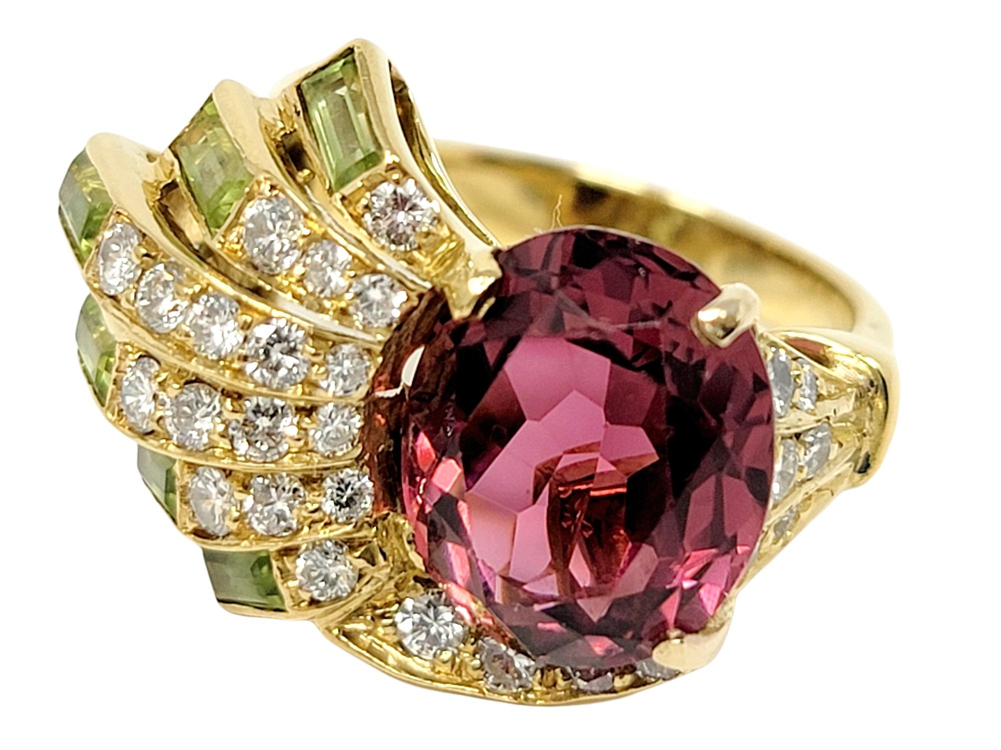 Ring size: 6

Bright and beautiful multi-gemstone ring featuring pink tourmaline, diamonds and peridots by Sabbadini. Set in an asymmetrical layout, the sizeable oval pink stone is accented by a sparkling spray of diamonds and peridot, filling the