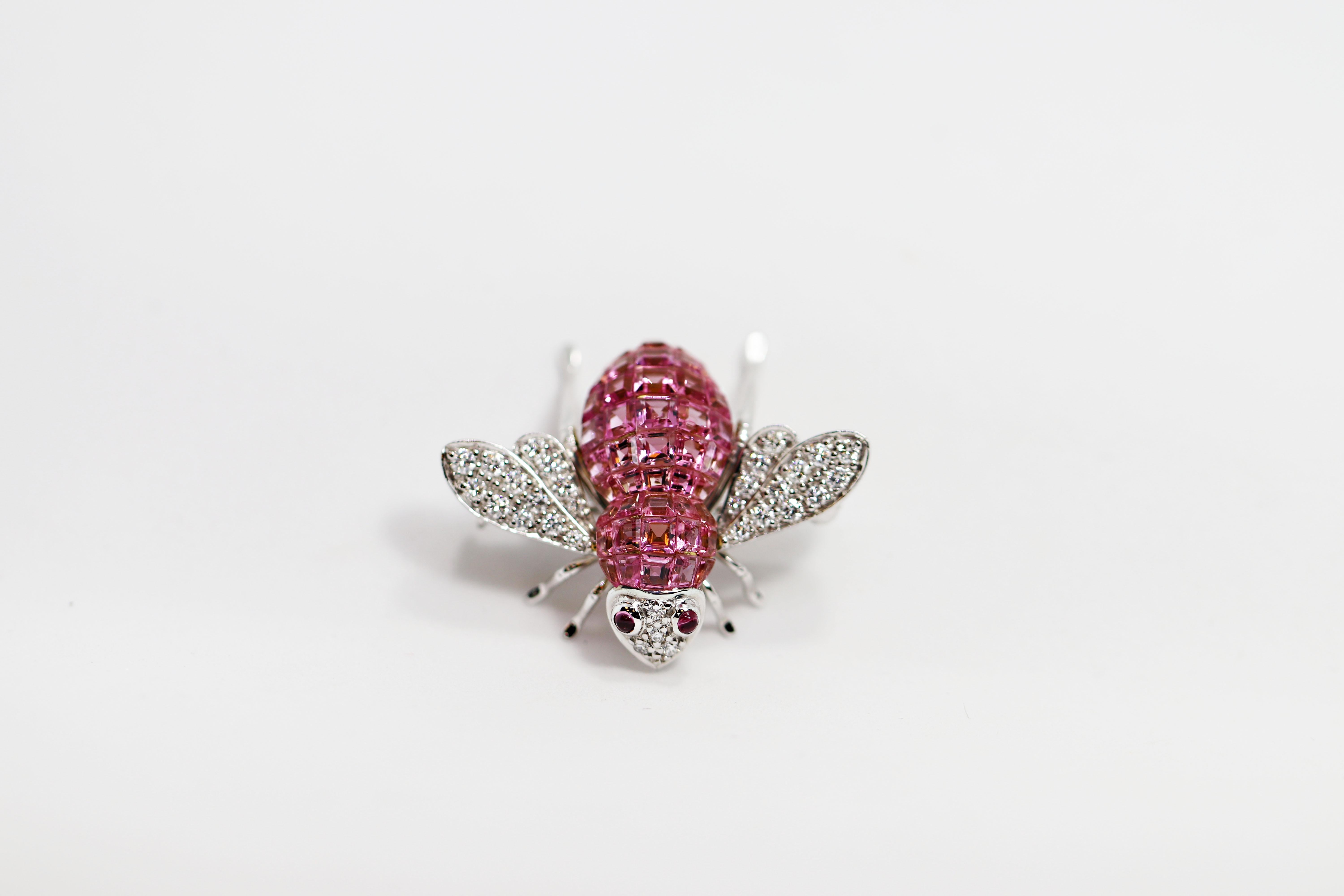 Iconic Sabbadini bee brooch handcrafted in Italy by master artisans. This exquisite brooch is set with square cut pink tourmalines invisible set inside the bugs body with an addition of two small cabochon pink tourmalines rub over set for its eyes.