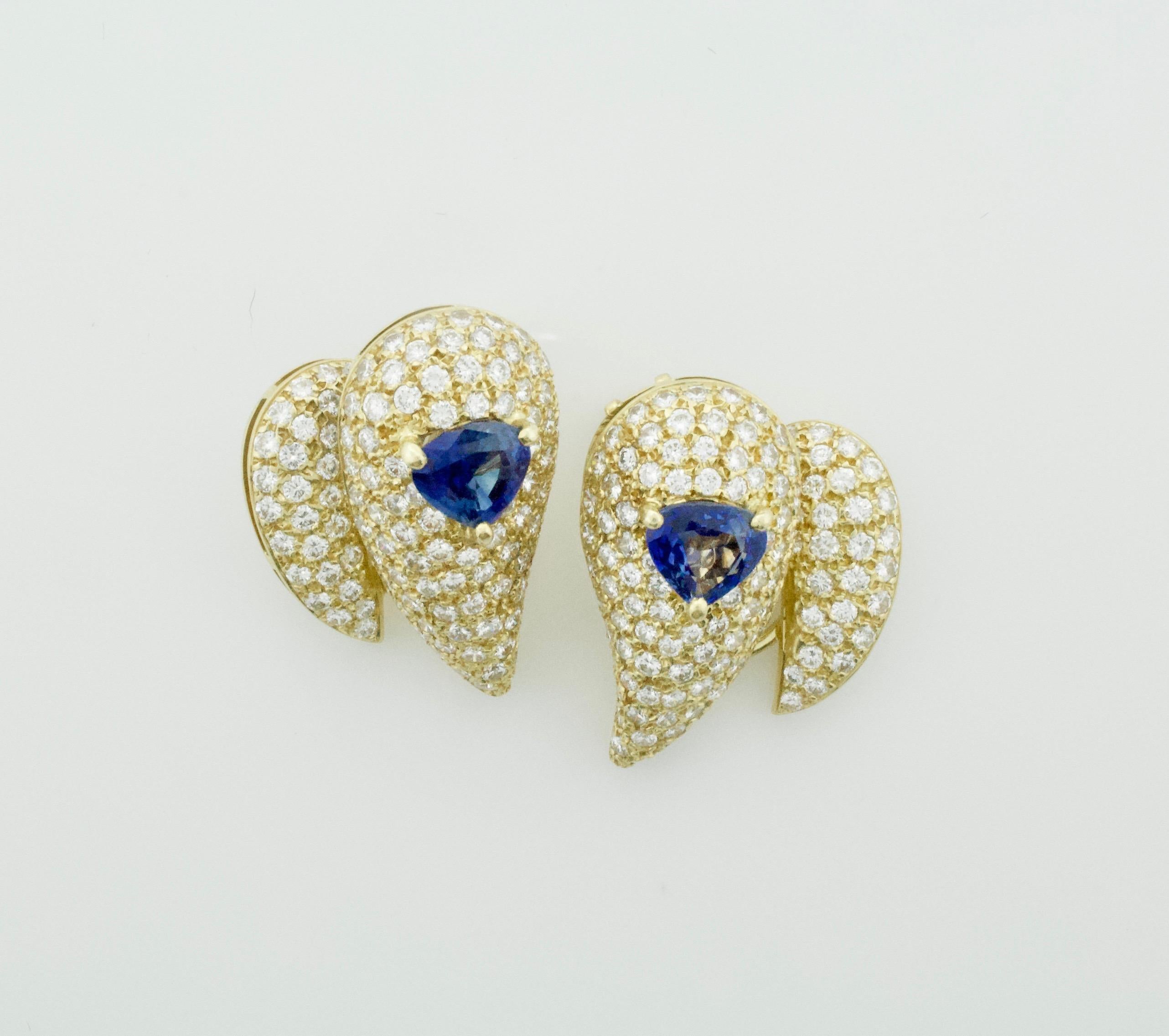 Sabbadini Unique Sapphire and Diamond Earrings in 18k Sap = 3.00 Dia = 7.00 cts.
Two Fancy Cut Sapphires Weighing 3.00 Carats Approximately [bright with no imperfections visible to the naked eye]
Two Hundred and Fifty Eight Round Brilliant Cut