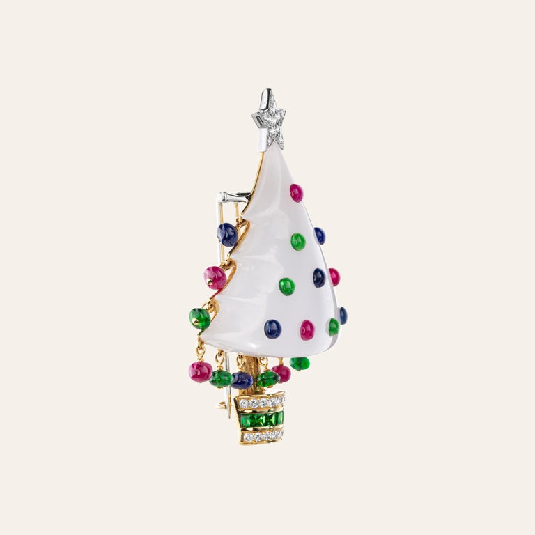 Sabbadini 18k Yellow gold christmas tree brooch, white jade, diamonds 0,60ct, sapphire beads 3,24ct, ruby beads 2,88ct, green garnet beads and square cut 3,10ct. Gold 13,34
Hand made jewelry & designed in Milan, in Via Montenapoleone.
This item