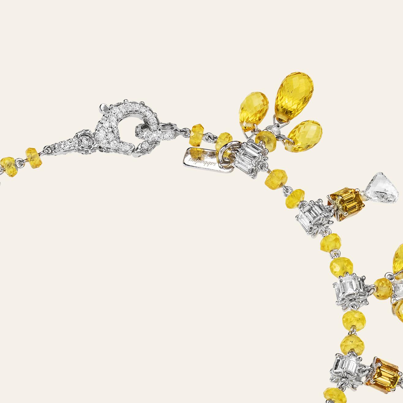 Sabbadini Jewelry Yellow Sapphire Charm Bracelet 
18k White gold charm bracelet, fancy shape cut yellow sapphires 29,32ct and diamonds 4,32ct. Gold 5,44
Handmade & designed in Milan, in Via Montenapoleone.
This item comes directly from the Sabbadini