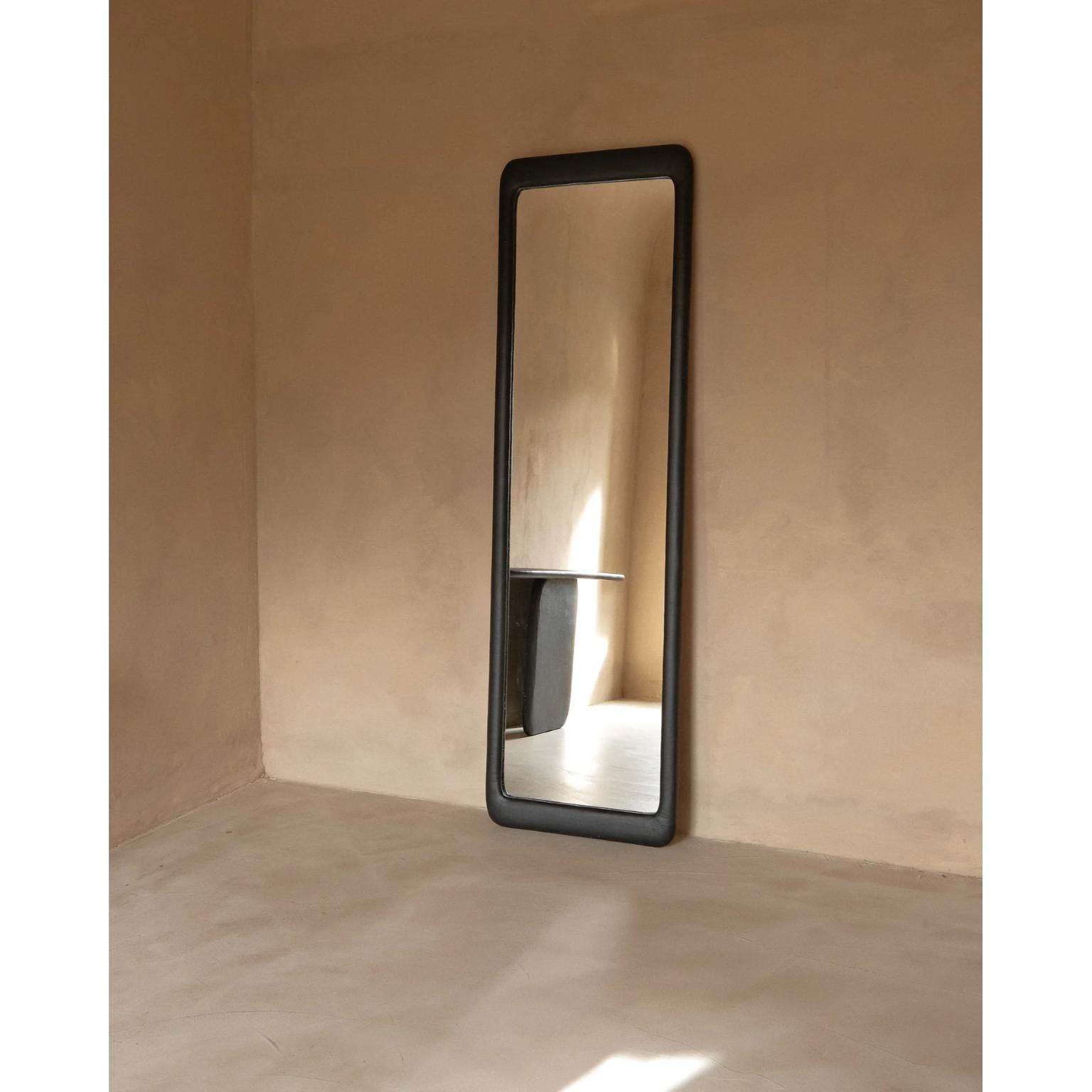 Sabbia Nero Large Wood And Mineral Lime Plaster Floor Mirror by Dennis Kaiser
Dimensions: D 5 x W 65 x H 220 cm.
Materials: Solid wood, mirror, and plaster.

Handcrafted in Tuscany, Italy. Customization is available on request. Please contact