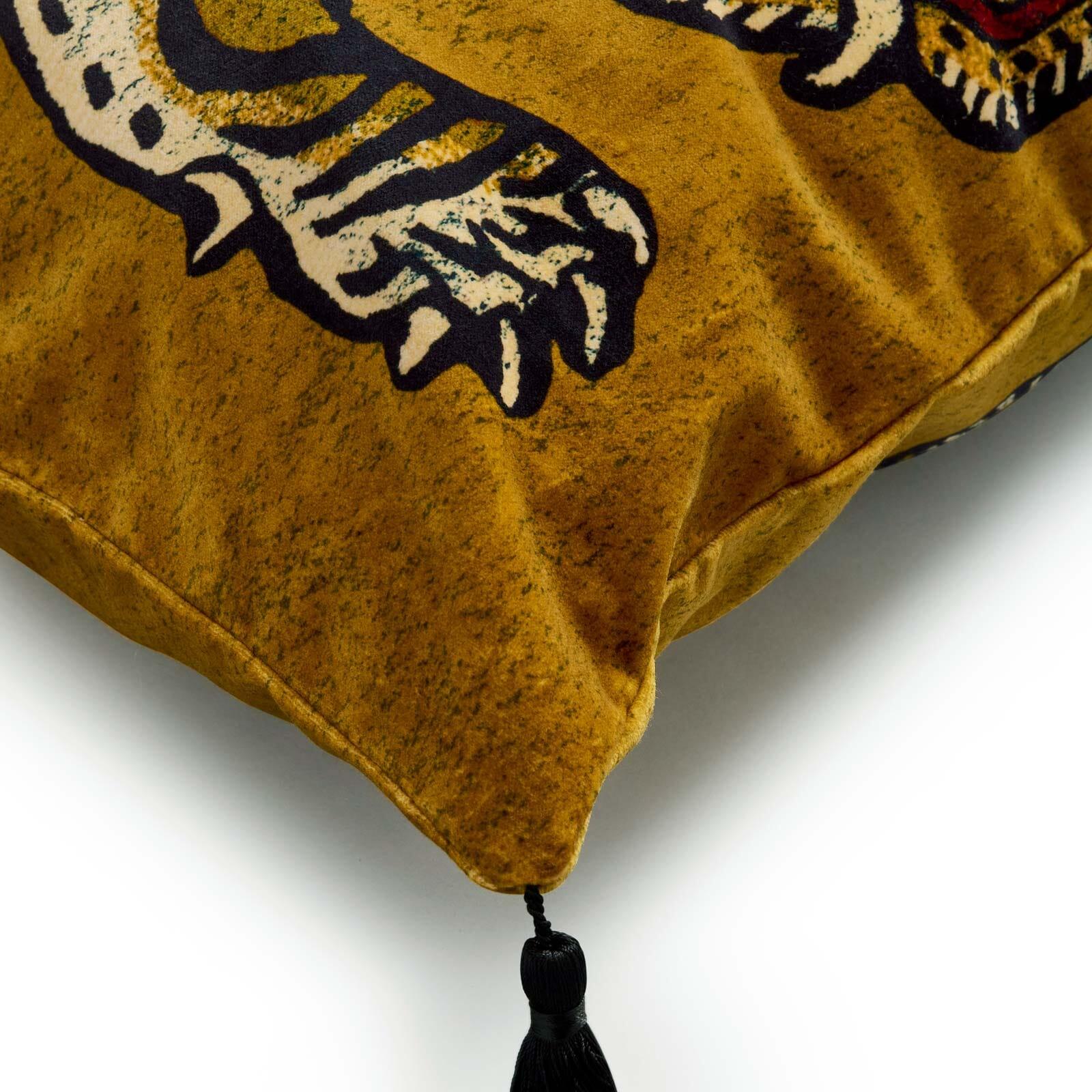 Elevate your sofa from simple to statement with this large gold velvet cushion. Featuring SABER, the Tibetan tiger, this tasselled design will delight animal lovers and interiors enthusiasts alike. House of Hackney donates a portion of the proceeds