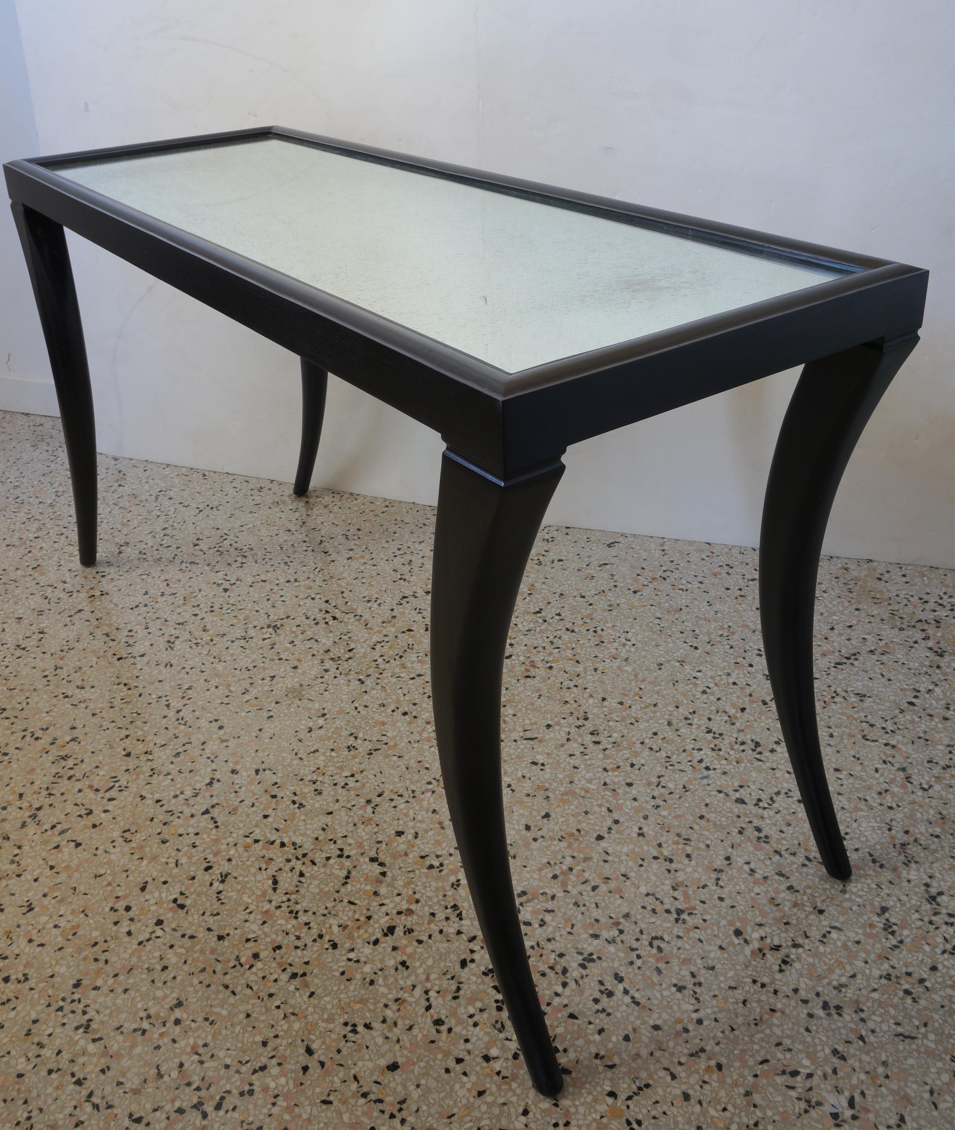 Vintage console table Saber legs ebonized finish vintaged mirror from a Palm Beach estate.