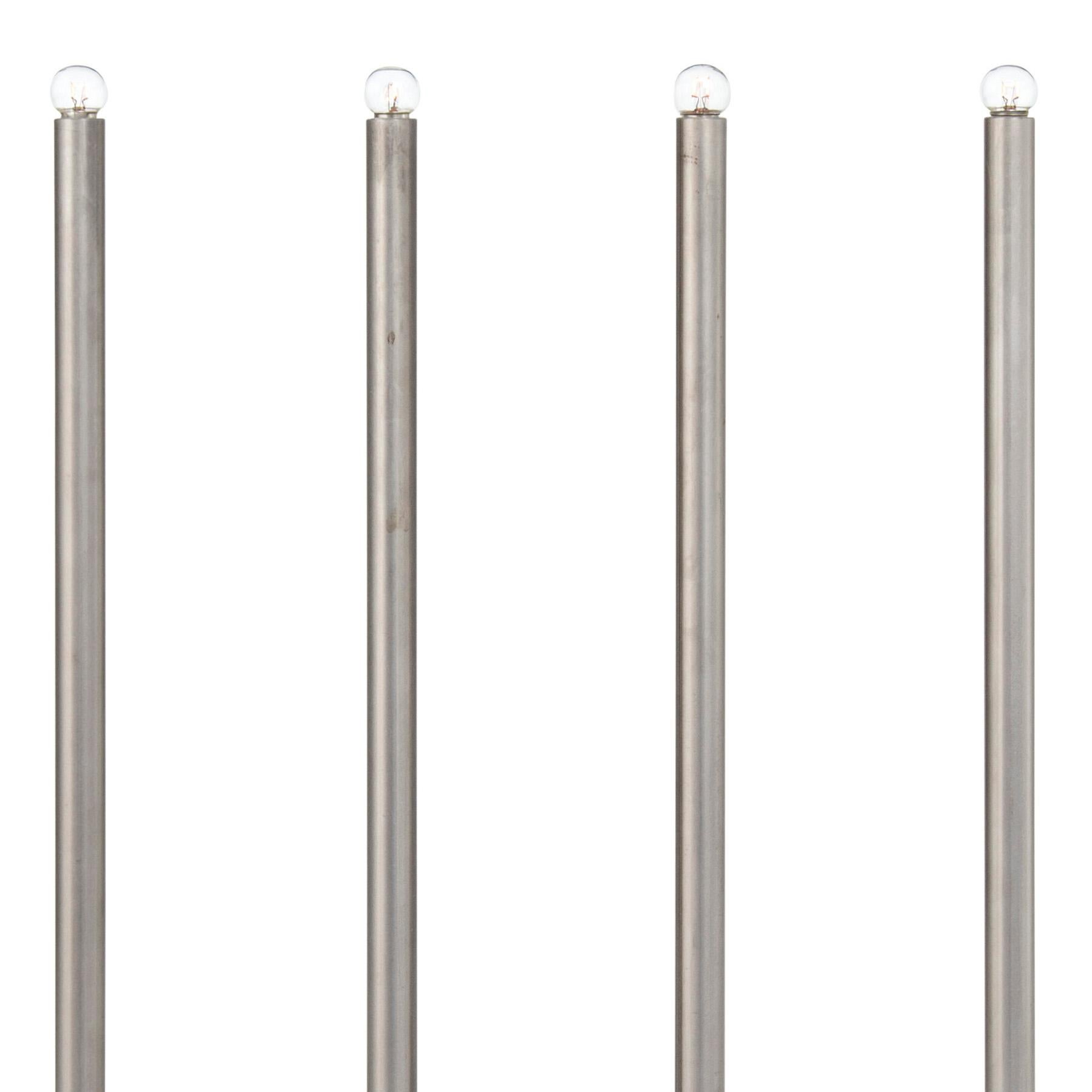 Table lamp model December Raw Iron with four arms designed by Sabina Grubbeson and manufactured by Konsthantverk. 

The production of lamps, wall lights and floor lamps are manufactured using craftsman’s techniques with the same materials and