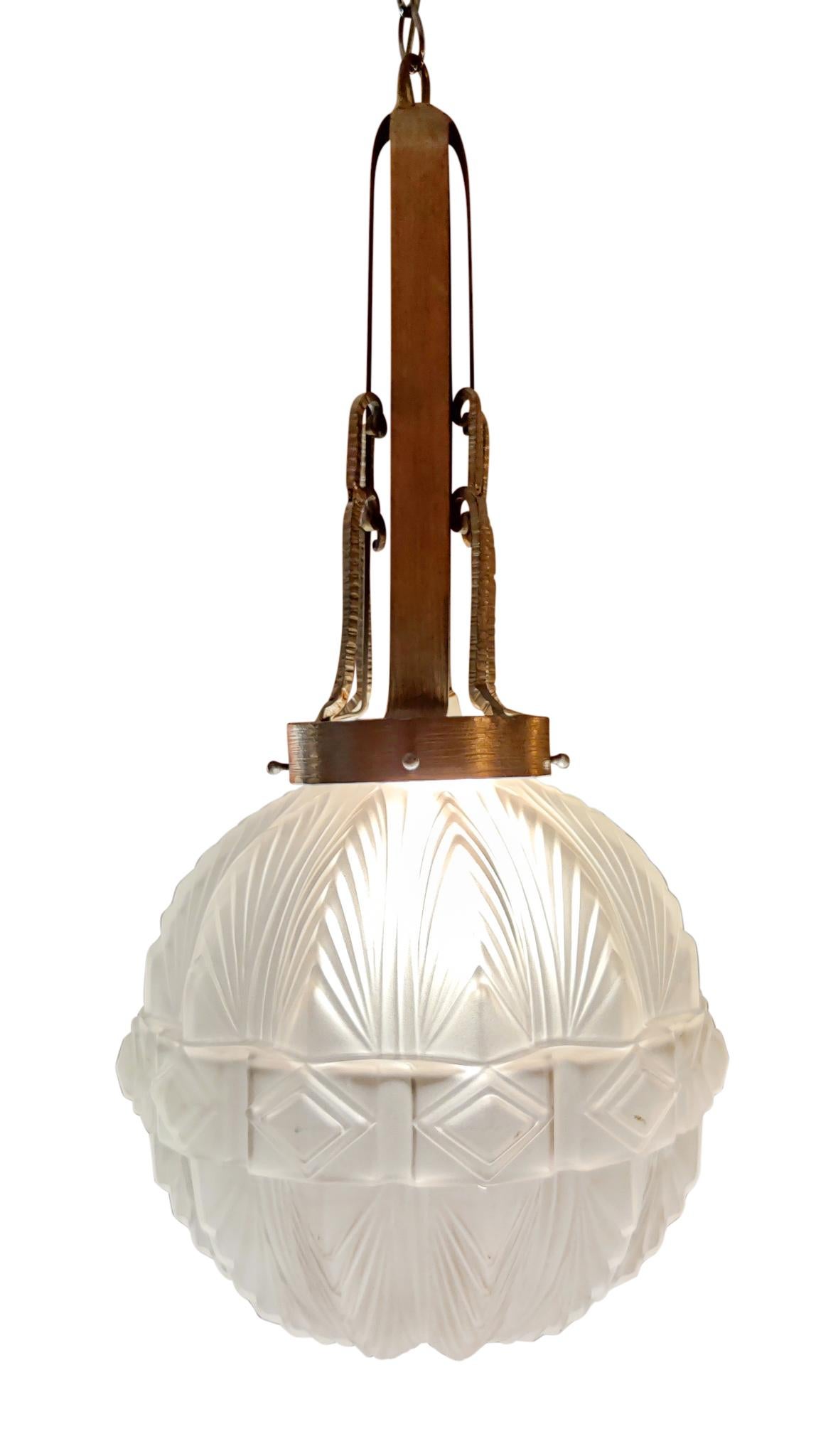 A beautiful Sabino attribution Art Deco lantern chandelier, single socket, standard incandescnet bulb, wattage variable, hardwired, and ready for use. Frosted glass globe is free of breaks and repairs and has no visible chips during normal use.